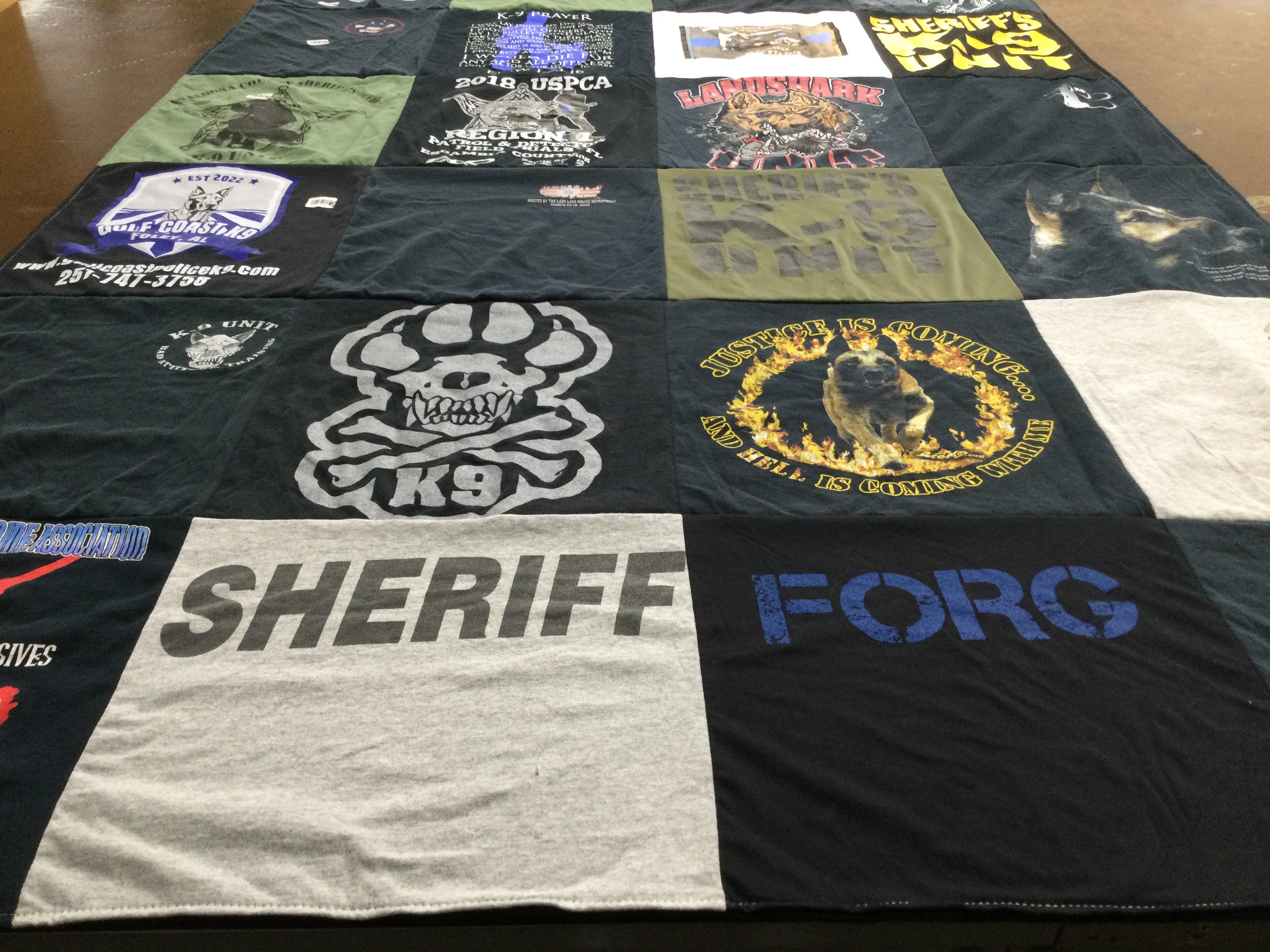 T-shirt quilt with law enforcement, k9 training themes by Courtney from FL