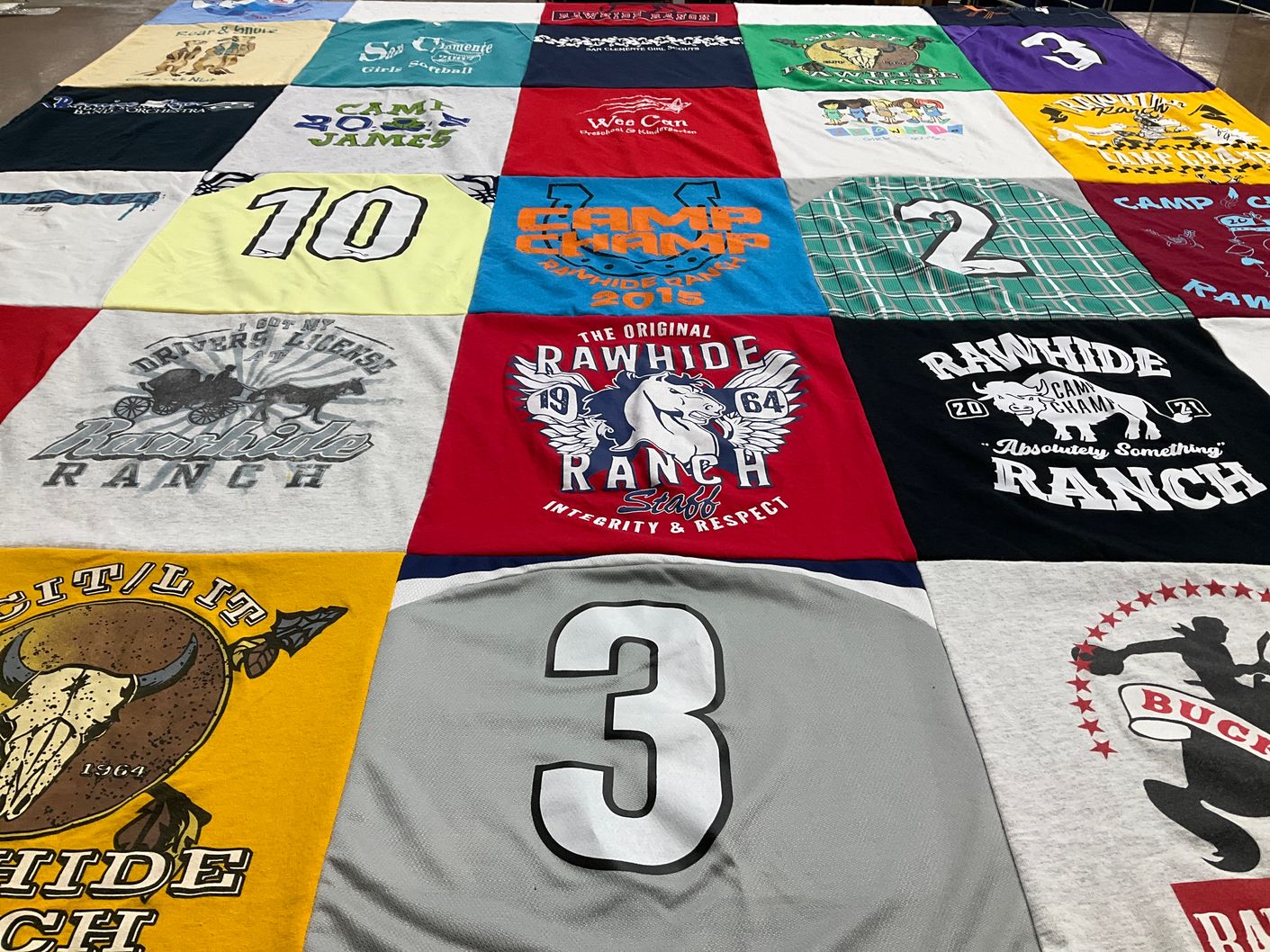 T-shirt quilt with camping, outdoor activities themes by Valerie from CA