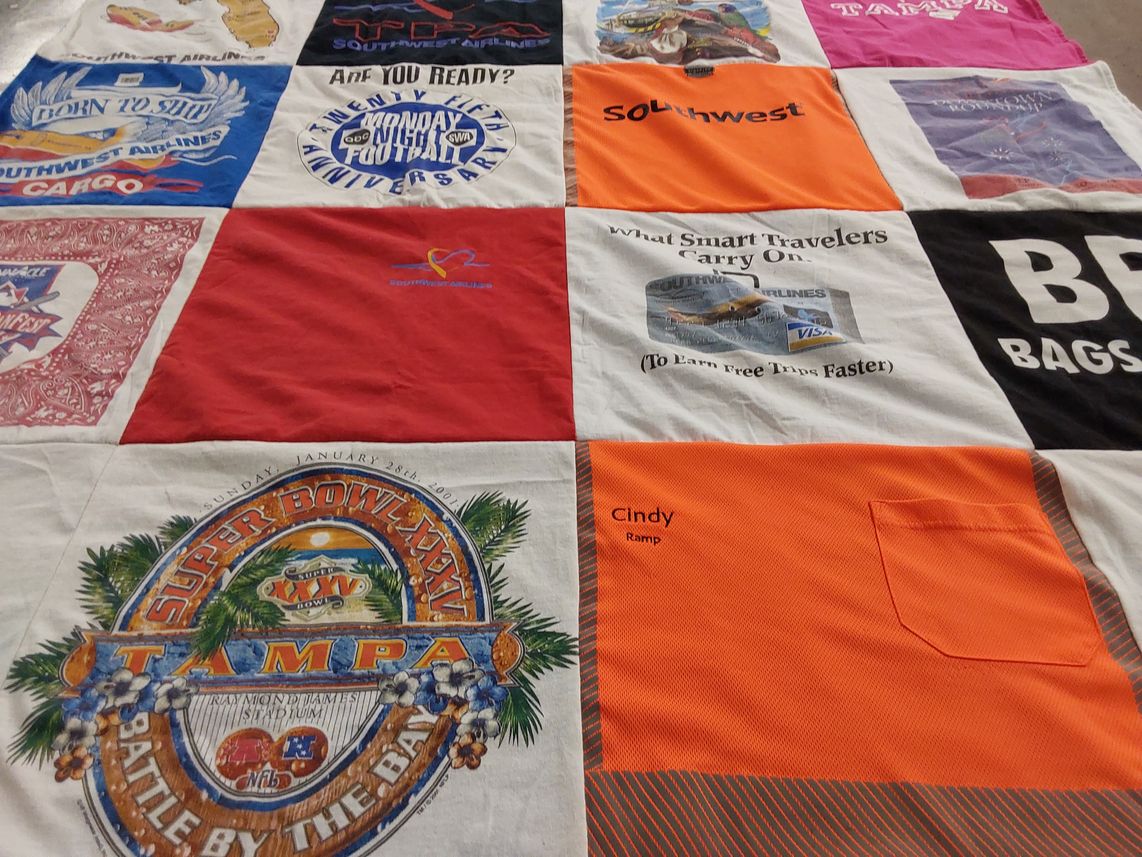 T-shirt quilt with traveling, sports themes by Cynthia from FL