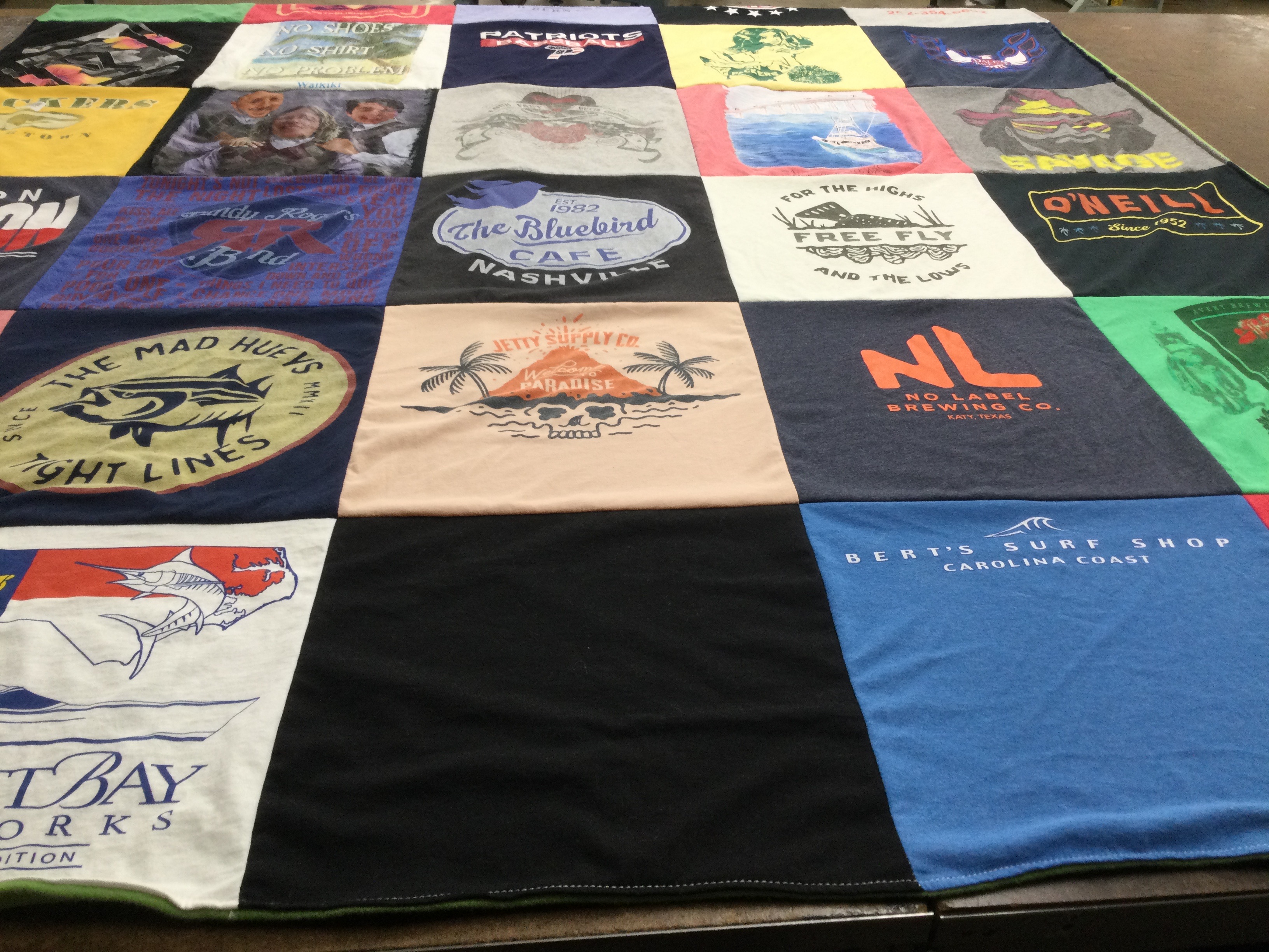 T-shirt quilt with fishing, surfing themes by Davna from TX