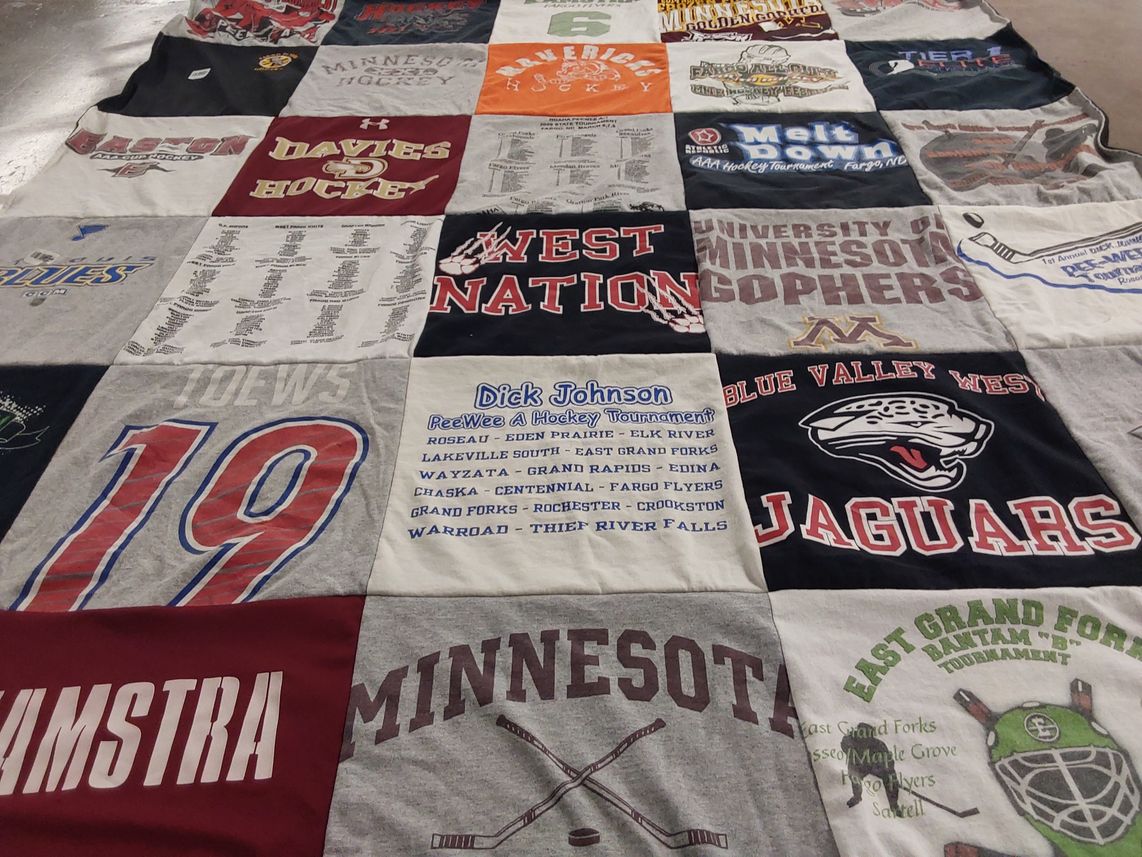 T-shirt quilt featuring blue valley west jaguars, davies hockey by Denise from ND