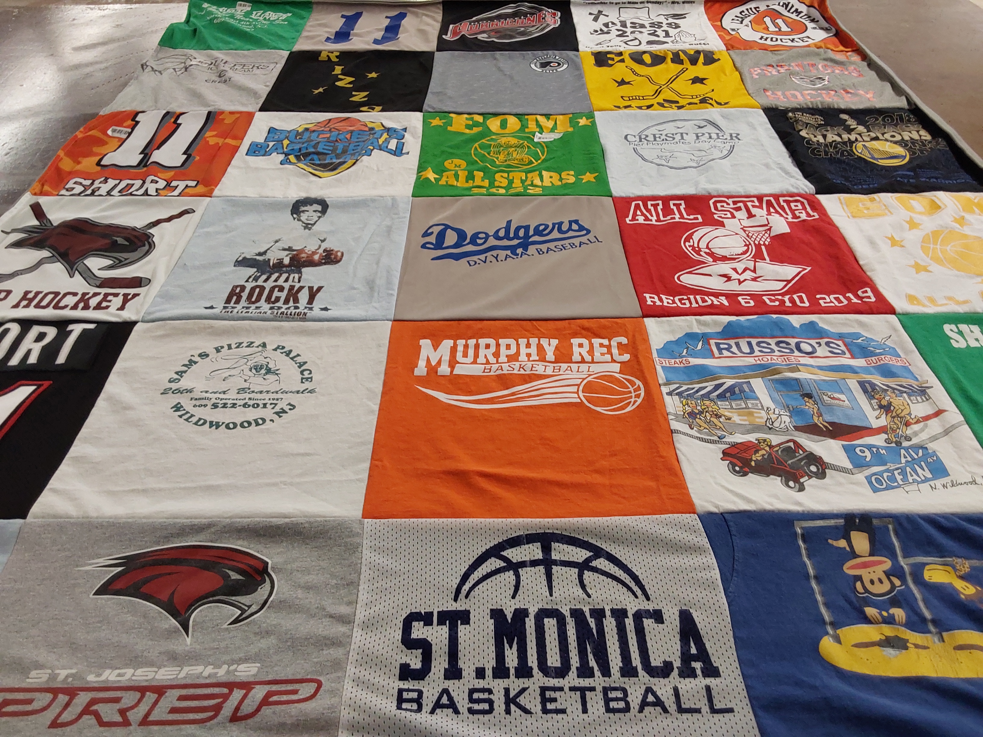 Custom Project Repat t-shirt quilt featuring shirts from st. joseph's preparatory school, st. monica's basketball.