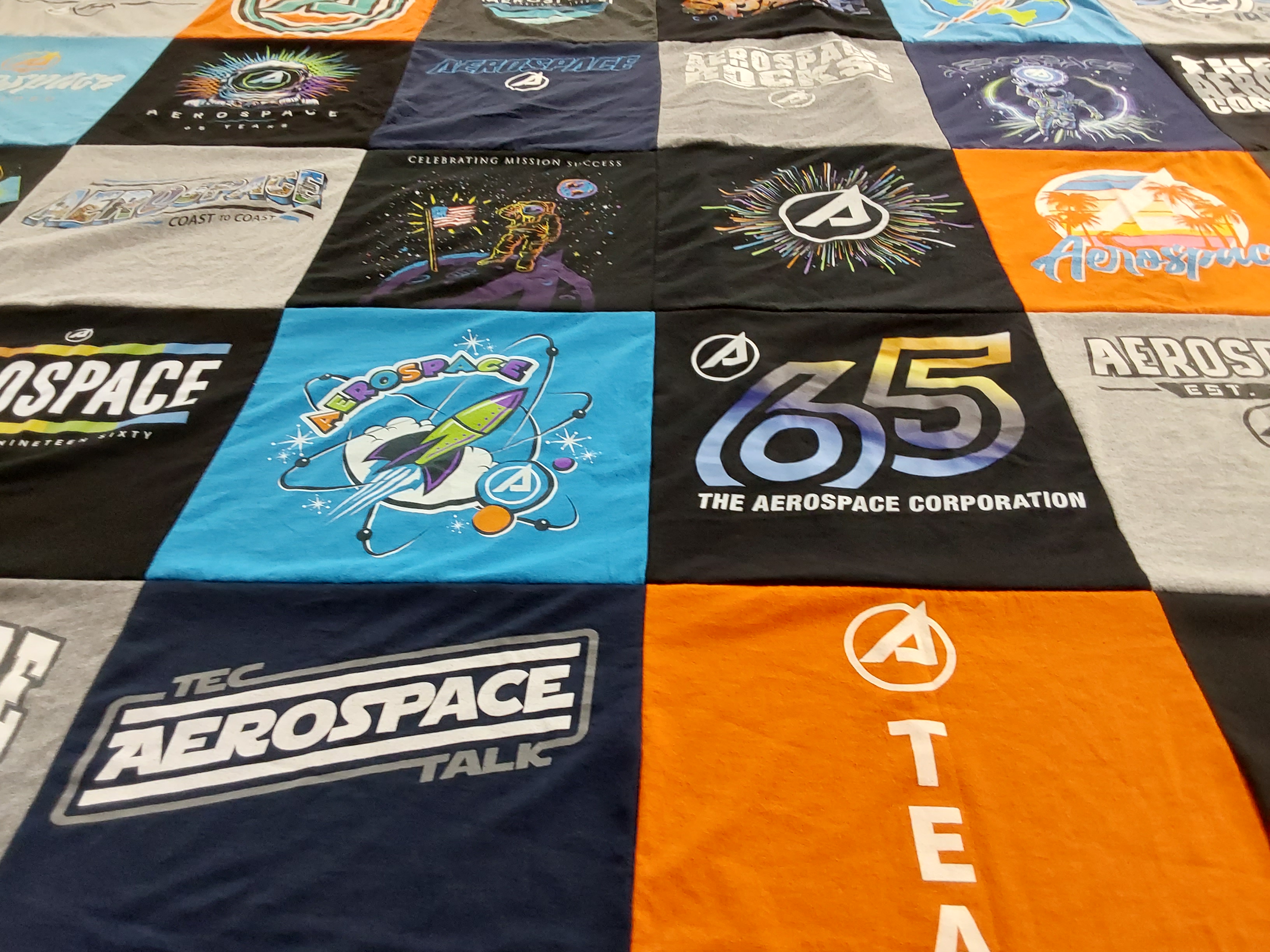 T-shirt quilt with aerospace, technology themes by Nicole from CA