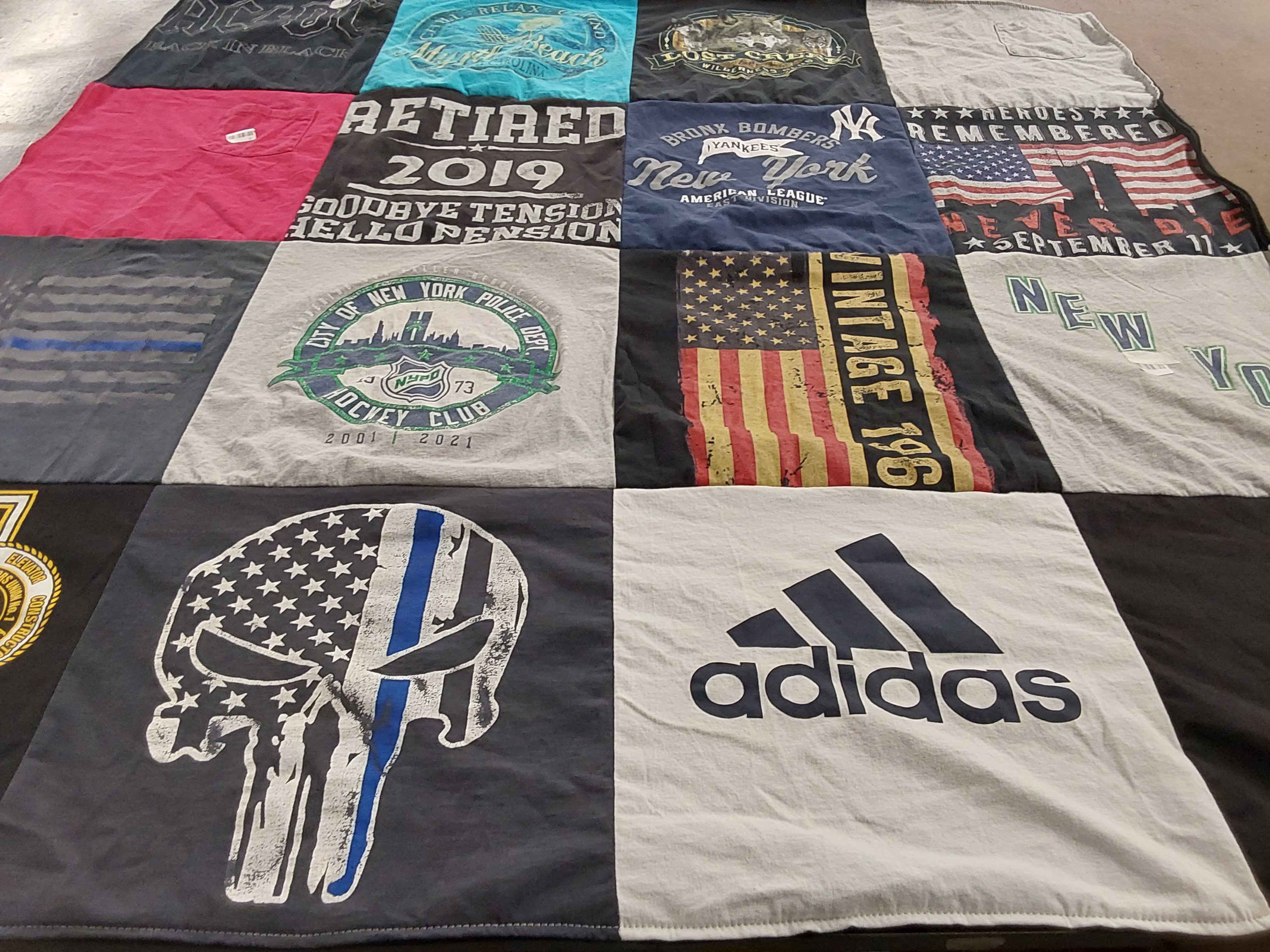 T-shirt quilt with hockey, law enforcement themes by Janice from SC