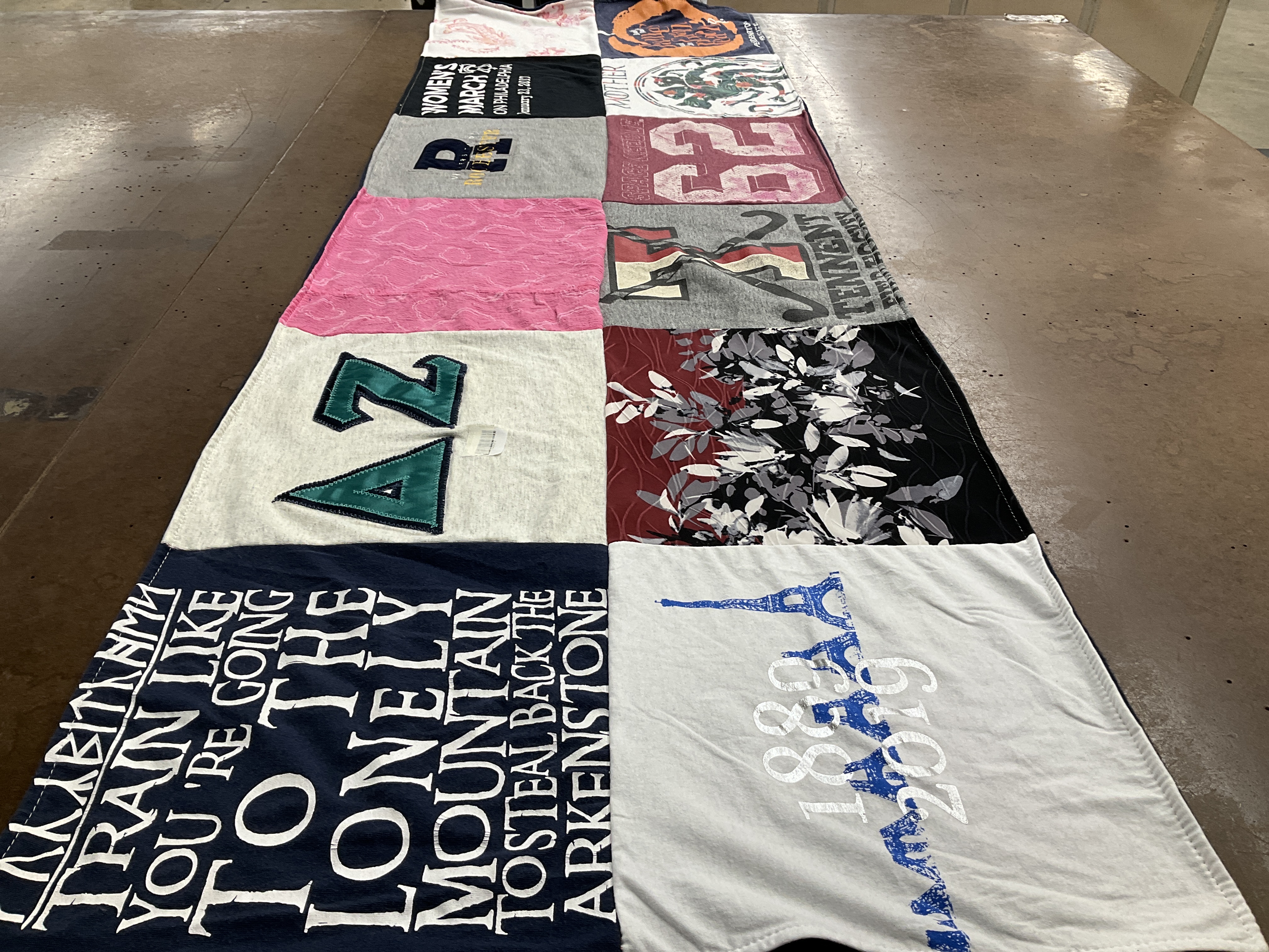 T-shirt quilt with reading, travel themes by Peter from PA