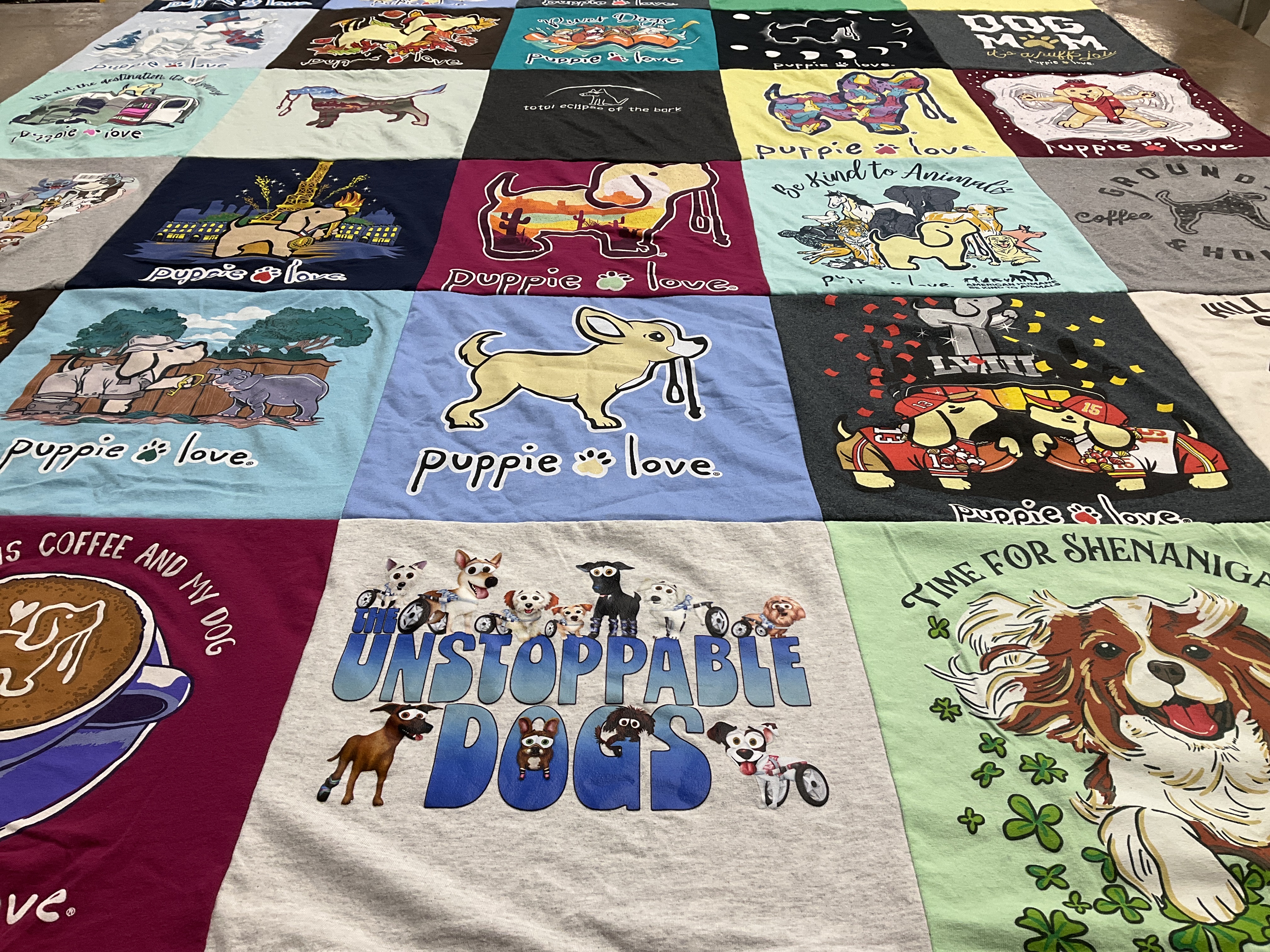 Custom Project Repat t-shirt quilt highlighting dogs, animal welfare themes.