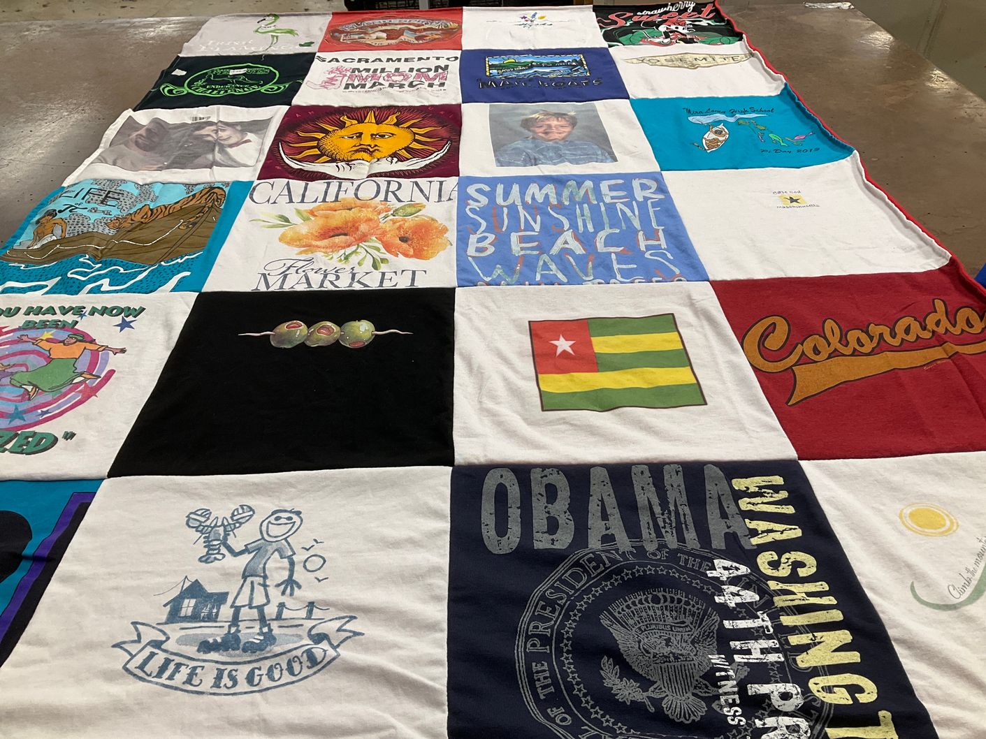 T-shirt quilt with beaches, markets themes by Mary from CA