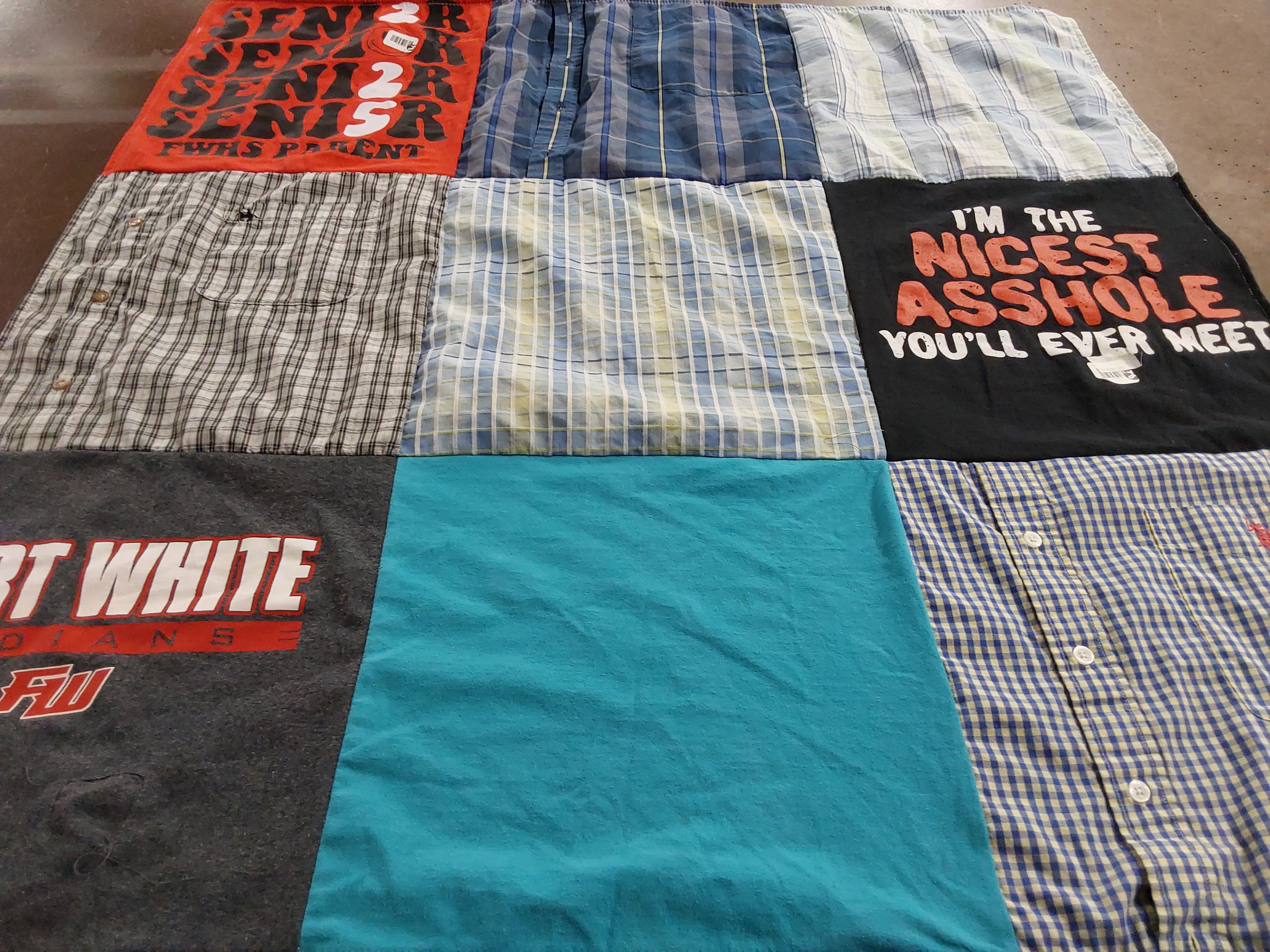 Custom Project Repat t-shirt quilt featuring shirts from fort white high school.