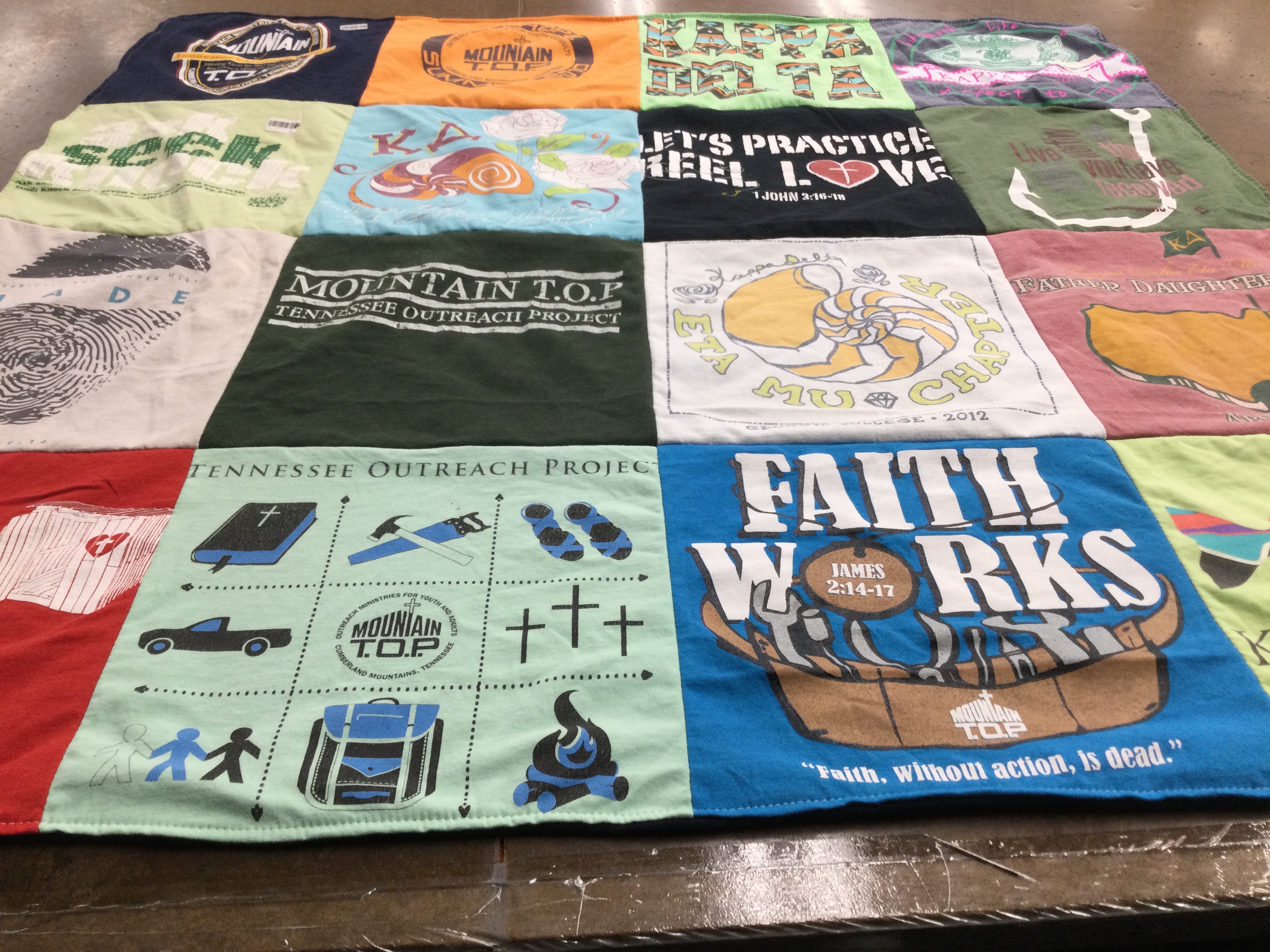 T-shirt quilt with community service, religious outreach themes by Donna from GA