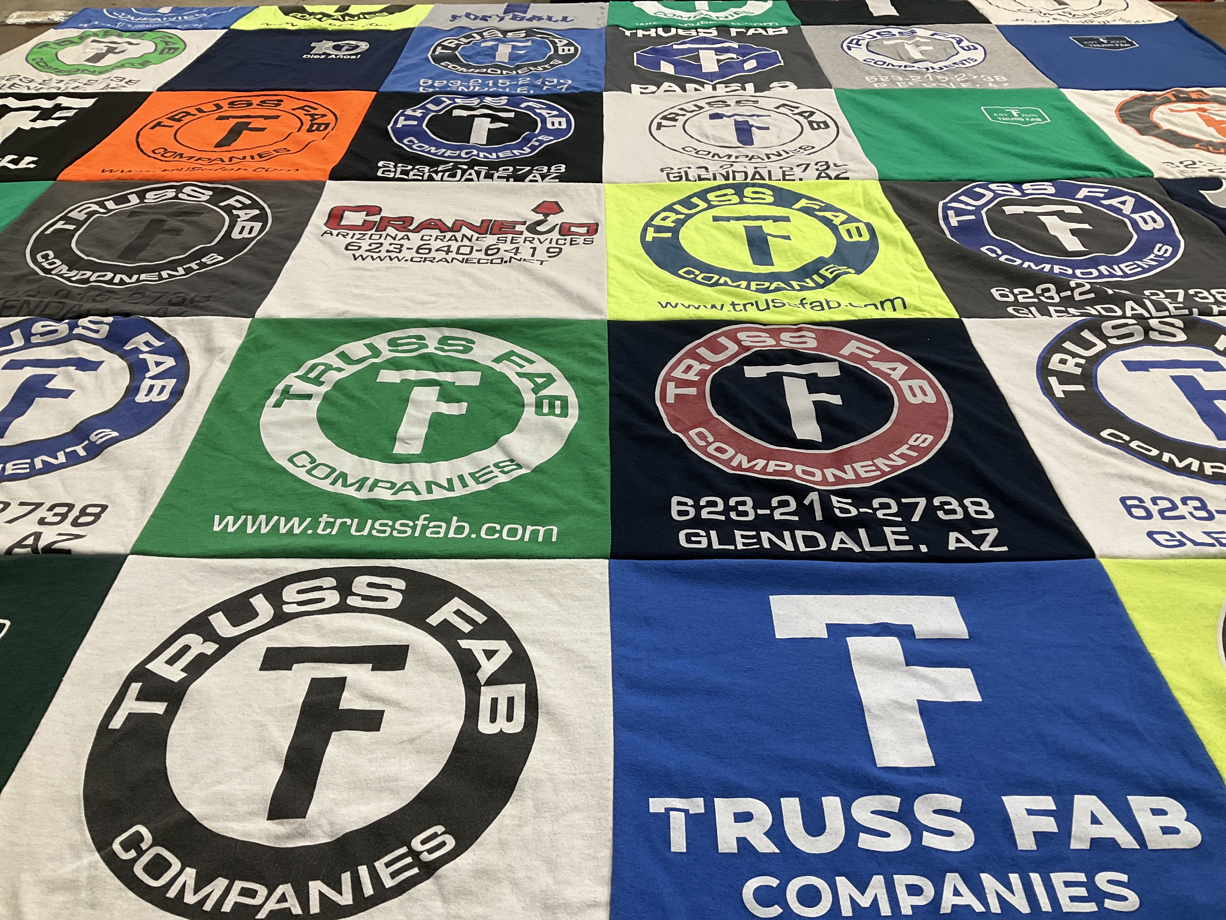 T-shirt quilt with construction, manufacturing themes by Courtney from AZ