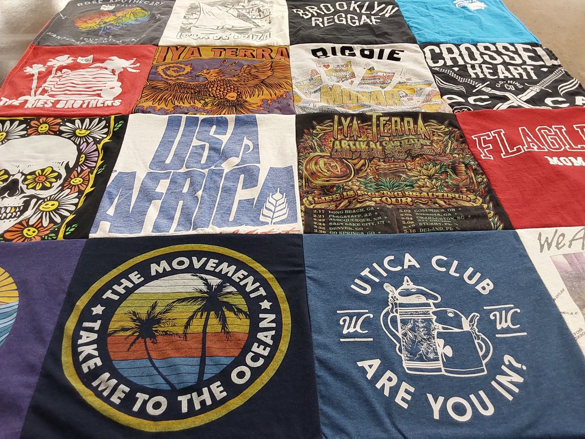 T-shirt quilt with music, travel themes by Gail from FL