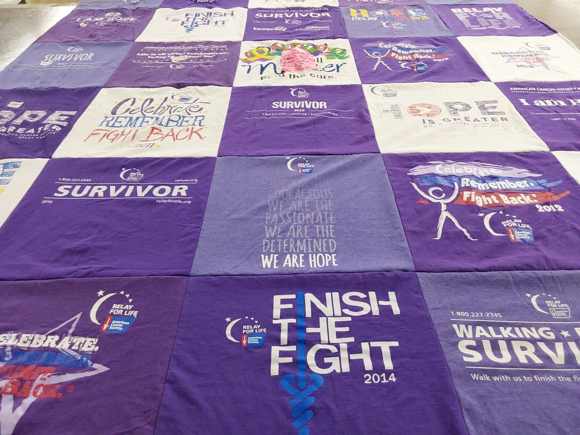 T-shirt quilt with cancer awareness, survivorship themes by Janice from WI