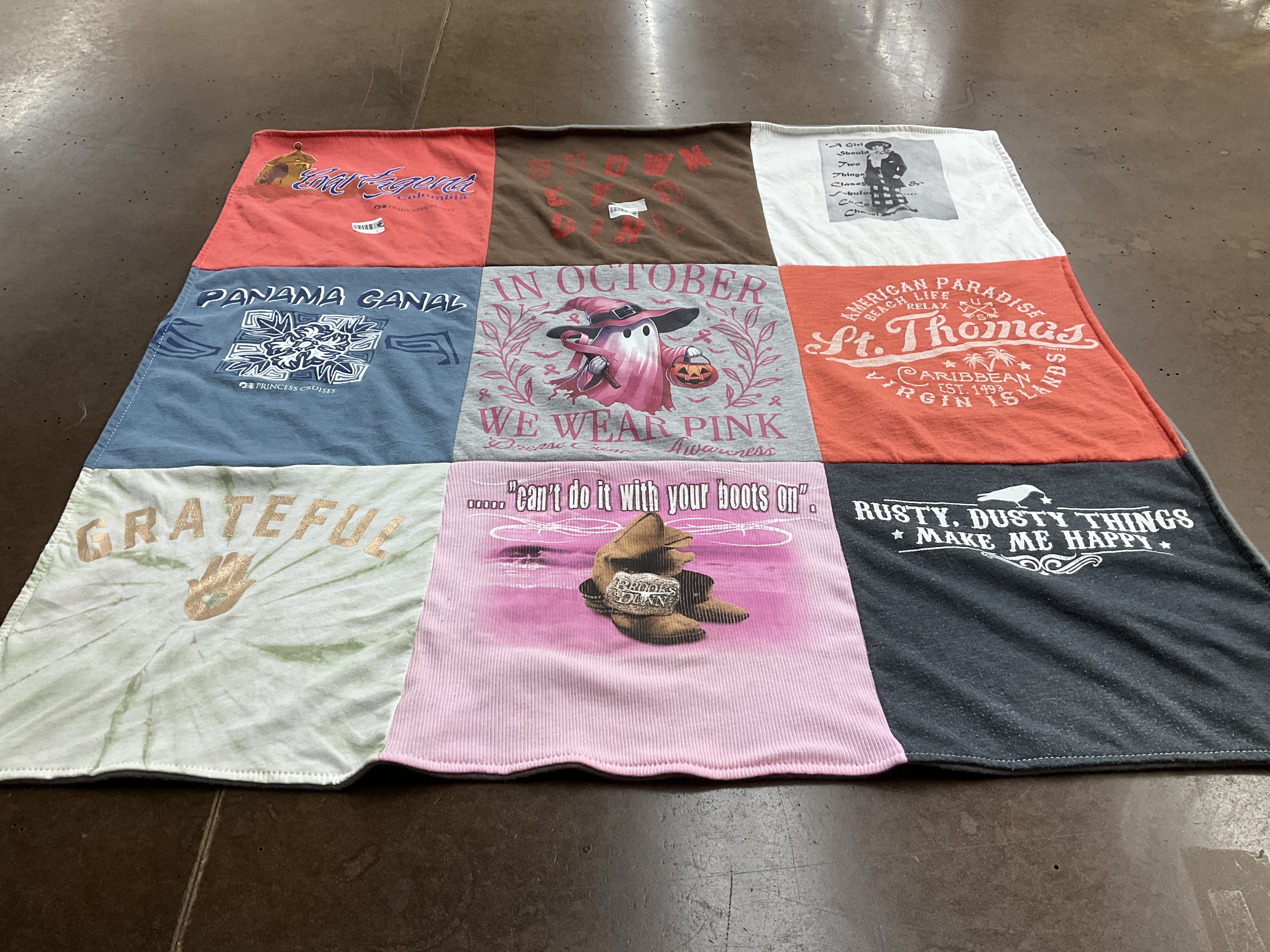 T-shirt quilt with travel, halloween themes by Judith from OH