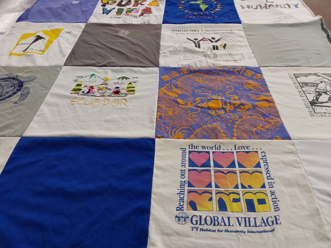 T-shirt quilt with humanitarian work, volunteering themes by Nancy from NH