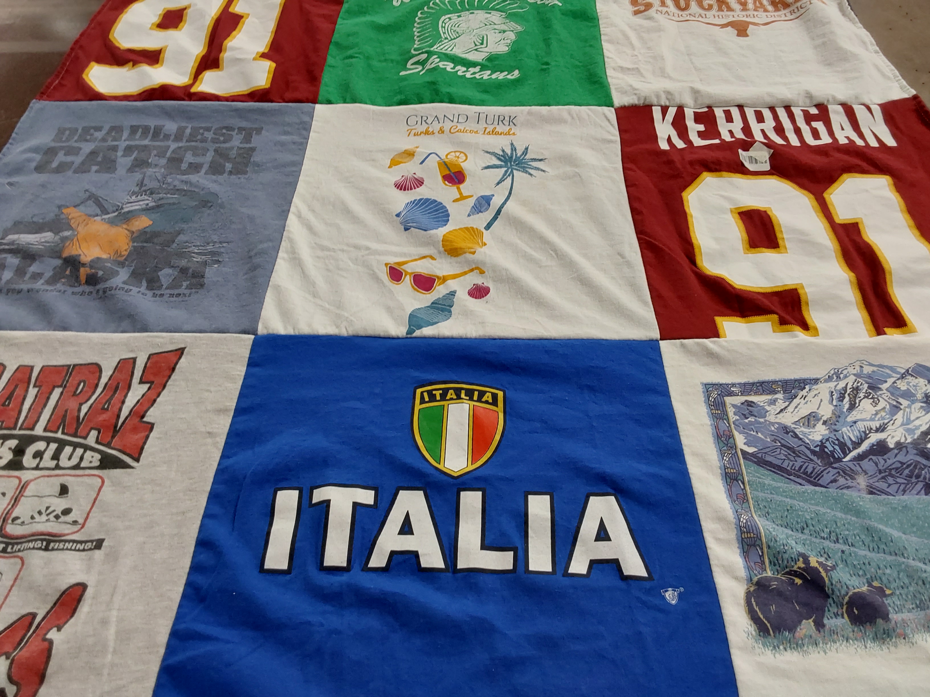 T-shirt quilt with fishing, travel themes by Stephanie from NC