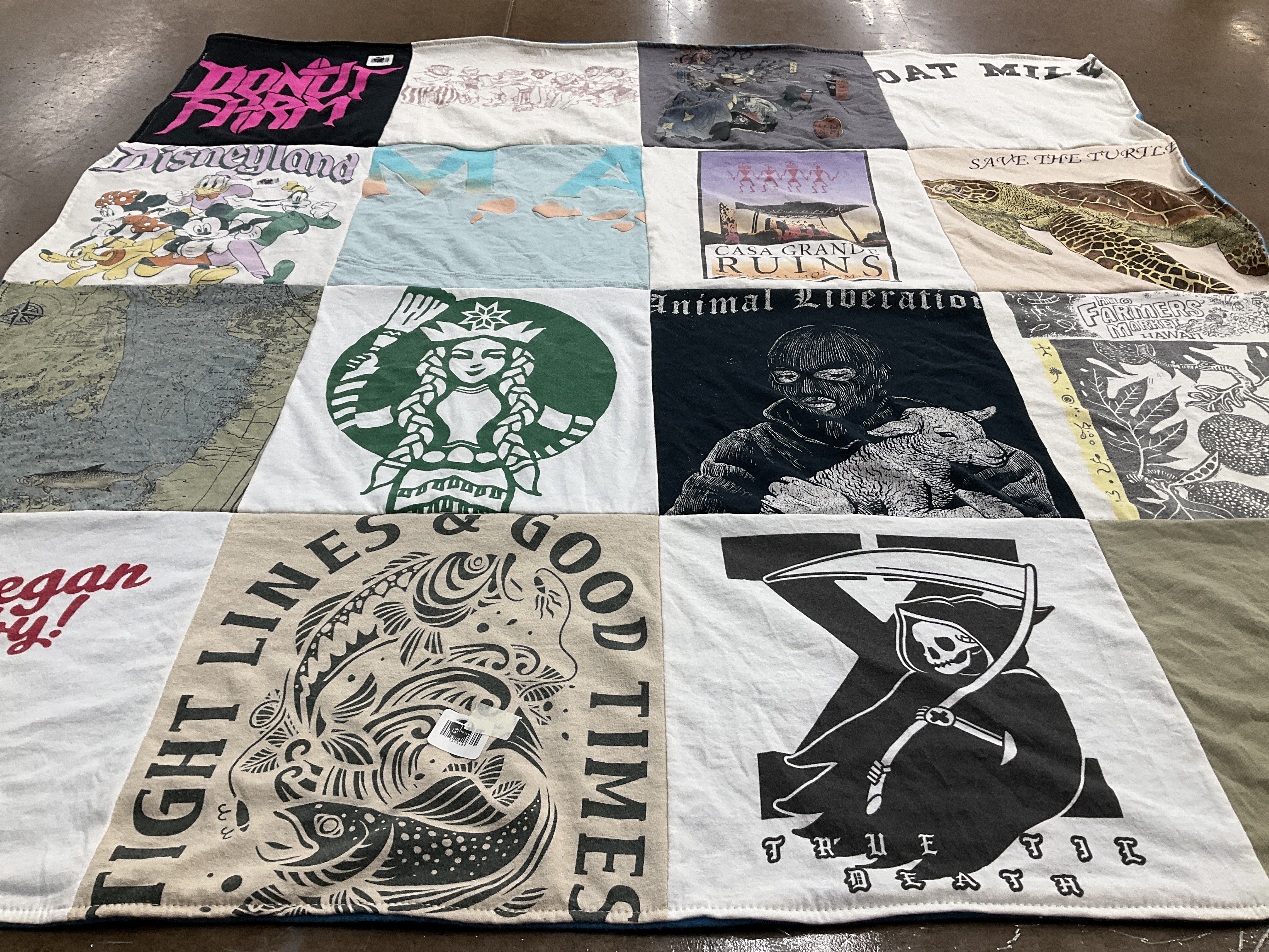 Custom Project Repat t-shirt quilt highlighting veganism, fishing themes.