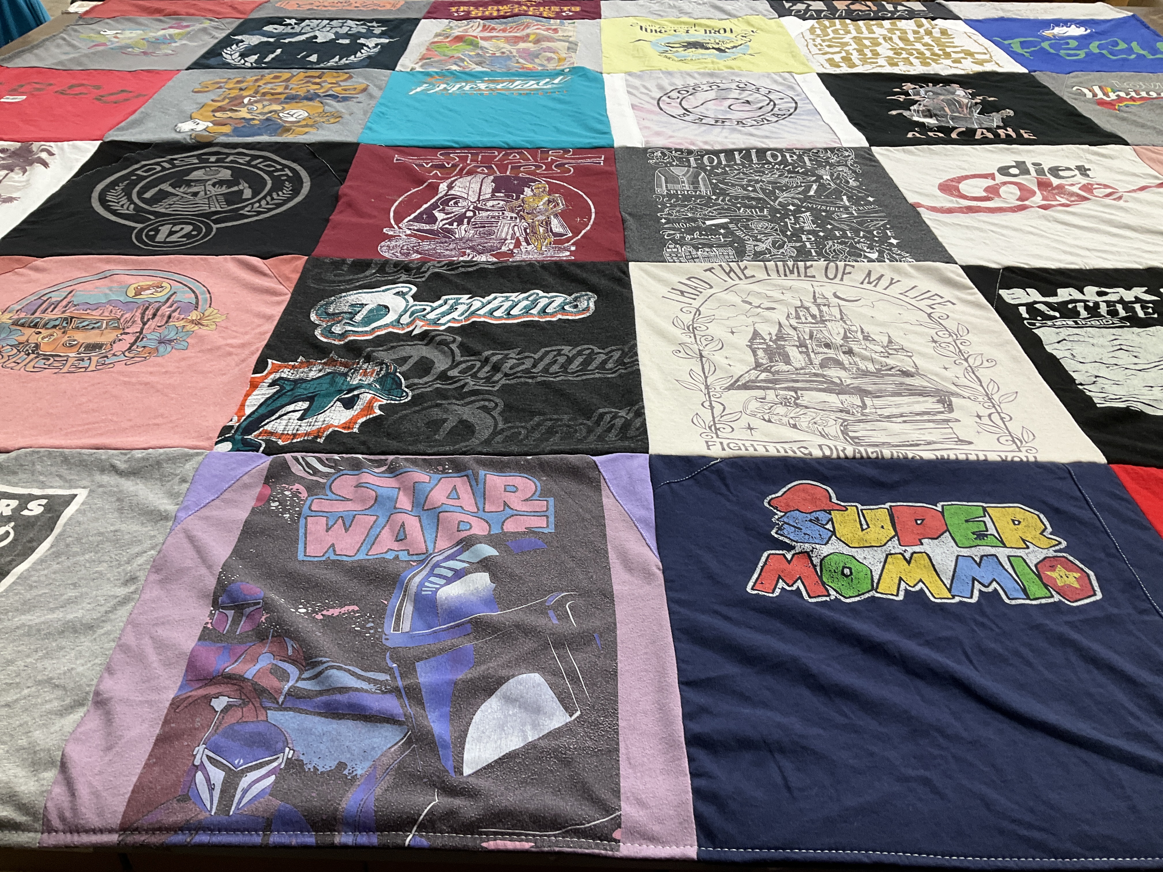 Custom Project Repat t-shirt quilt with miami dolphins team logos.