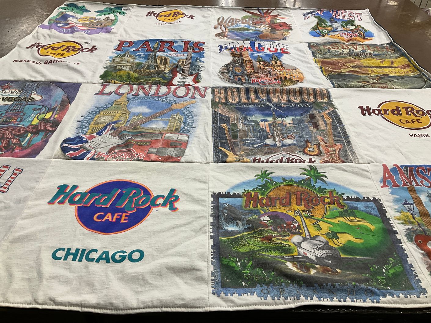 T-shirt quilt with travel, music themes by Kathy from IL