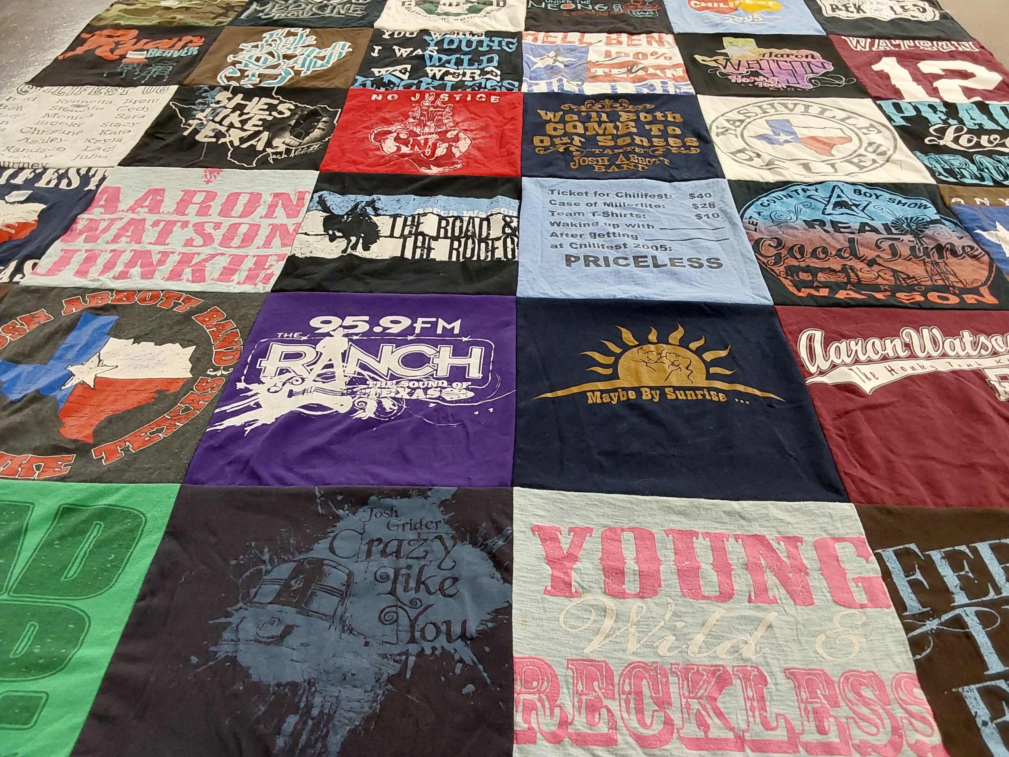 Custom Project Repat t-shirt quilt highlighting country music, concerts themes.