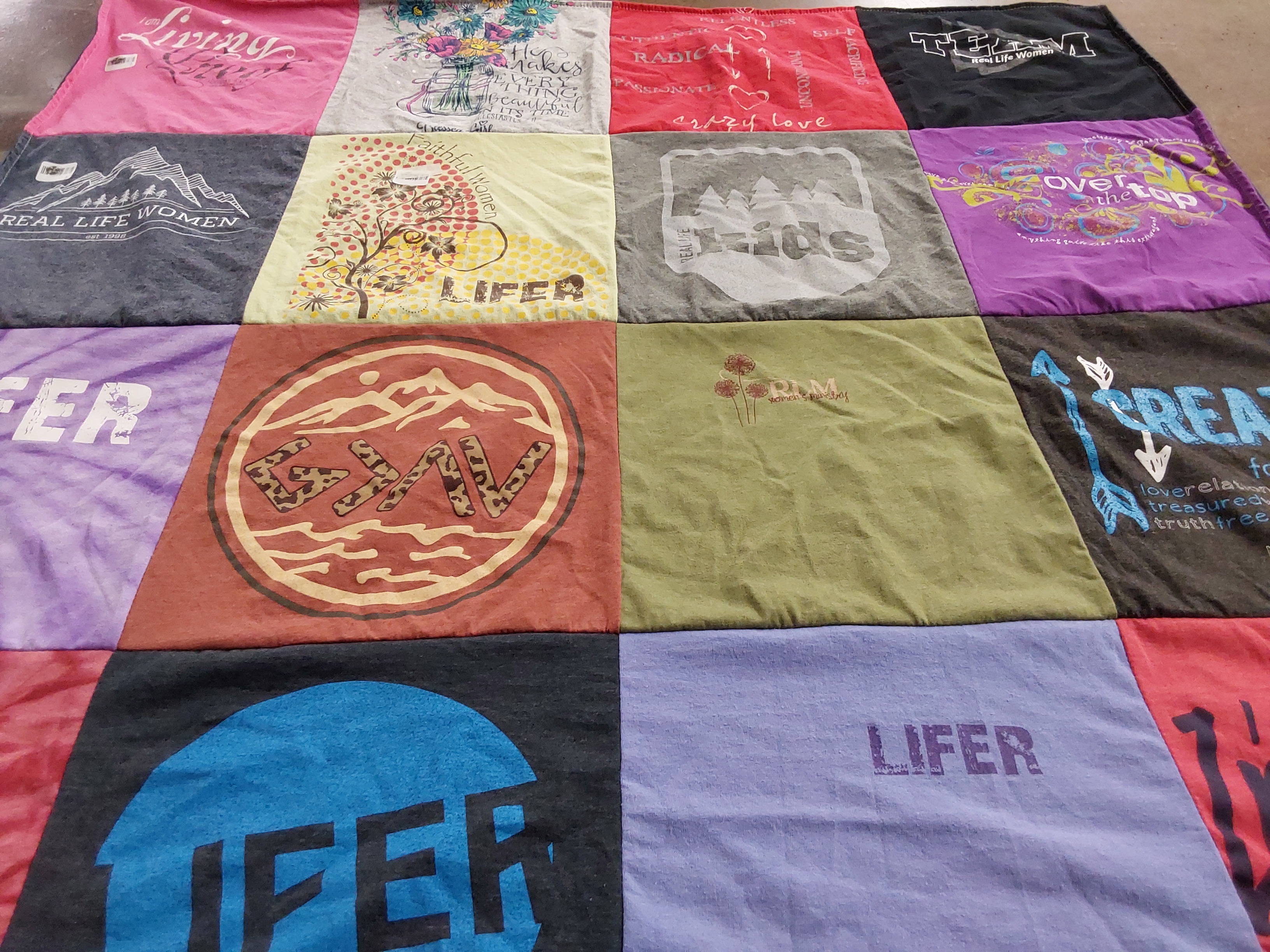 T-shirt quilt with community service, mental health themes by Pam from WA