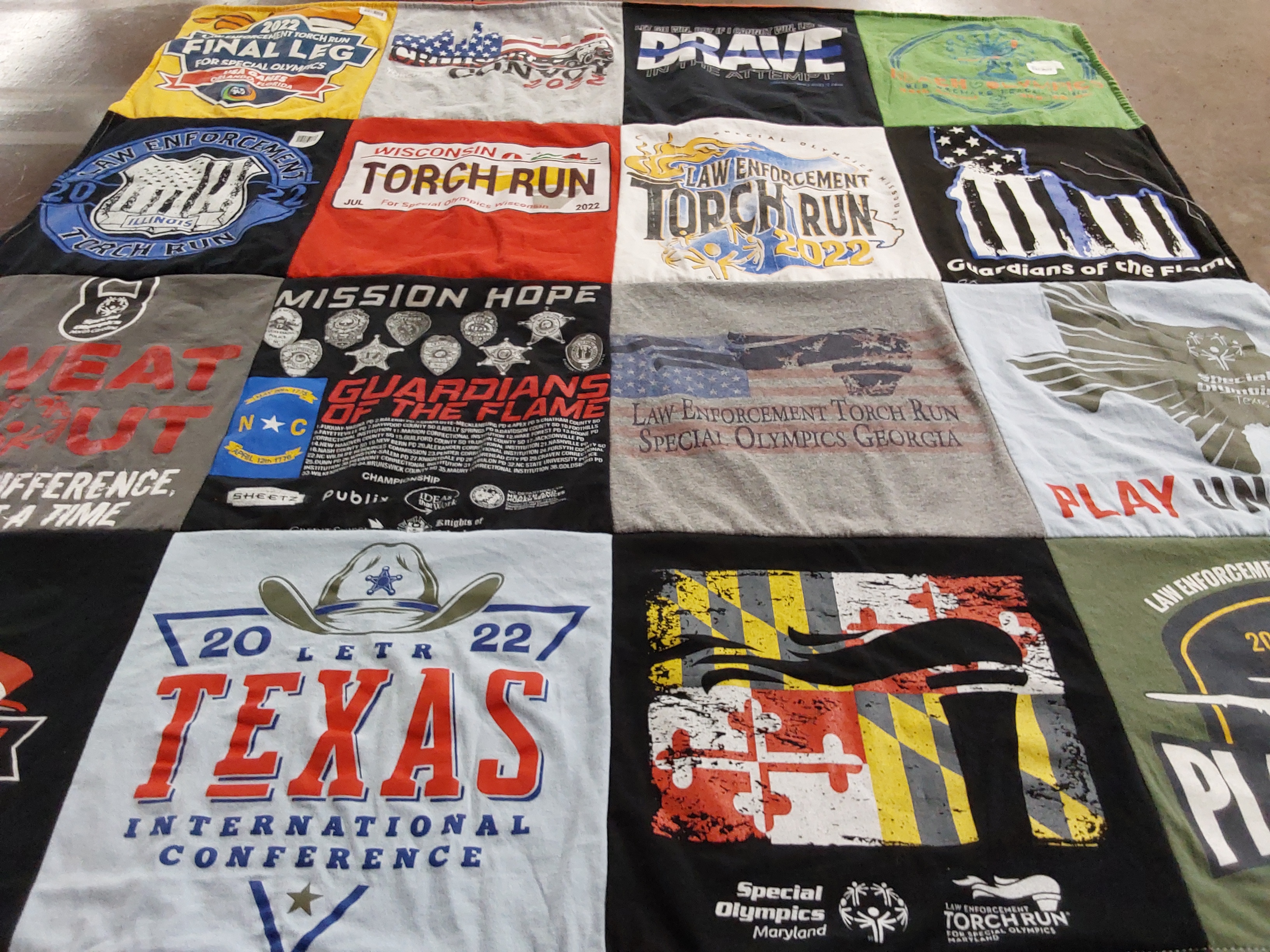 Custom Project Repat t-shirt quilt highlighting special olympics, law enforcement themes.