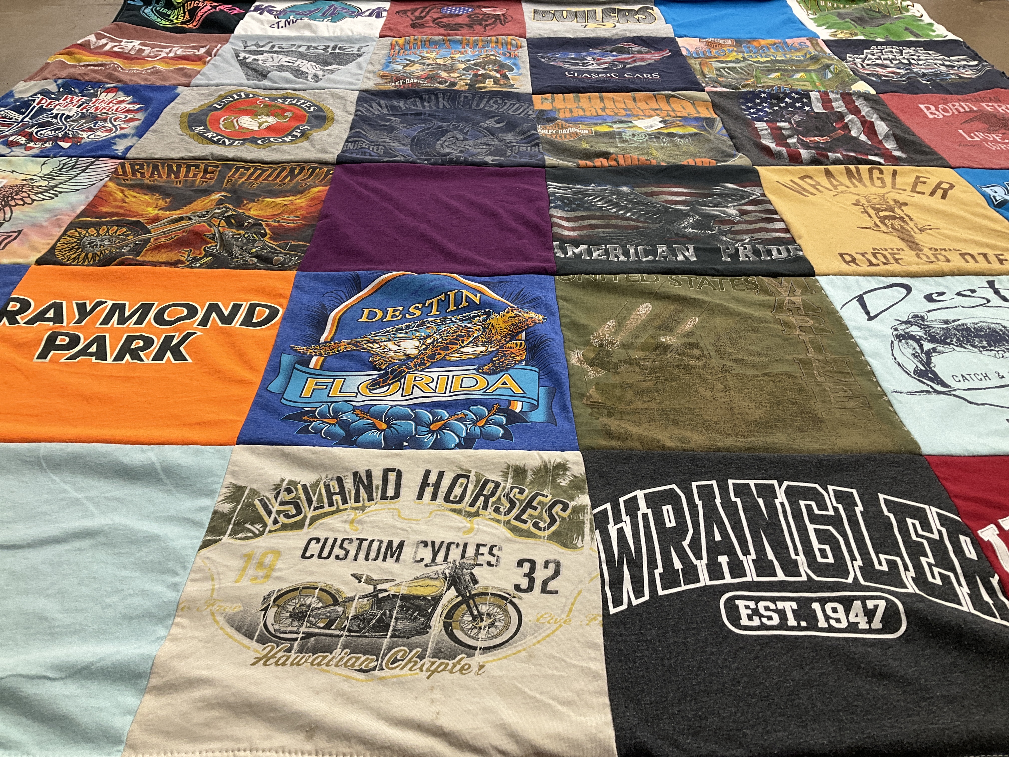 T-shirt quilt with travel, motorcycles themes by Mary from IN