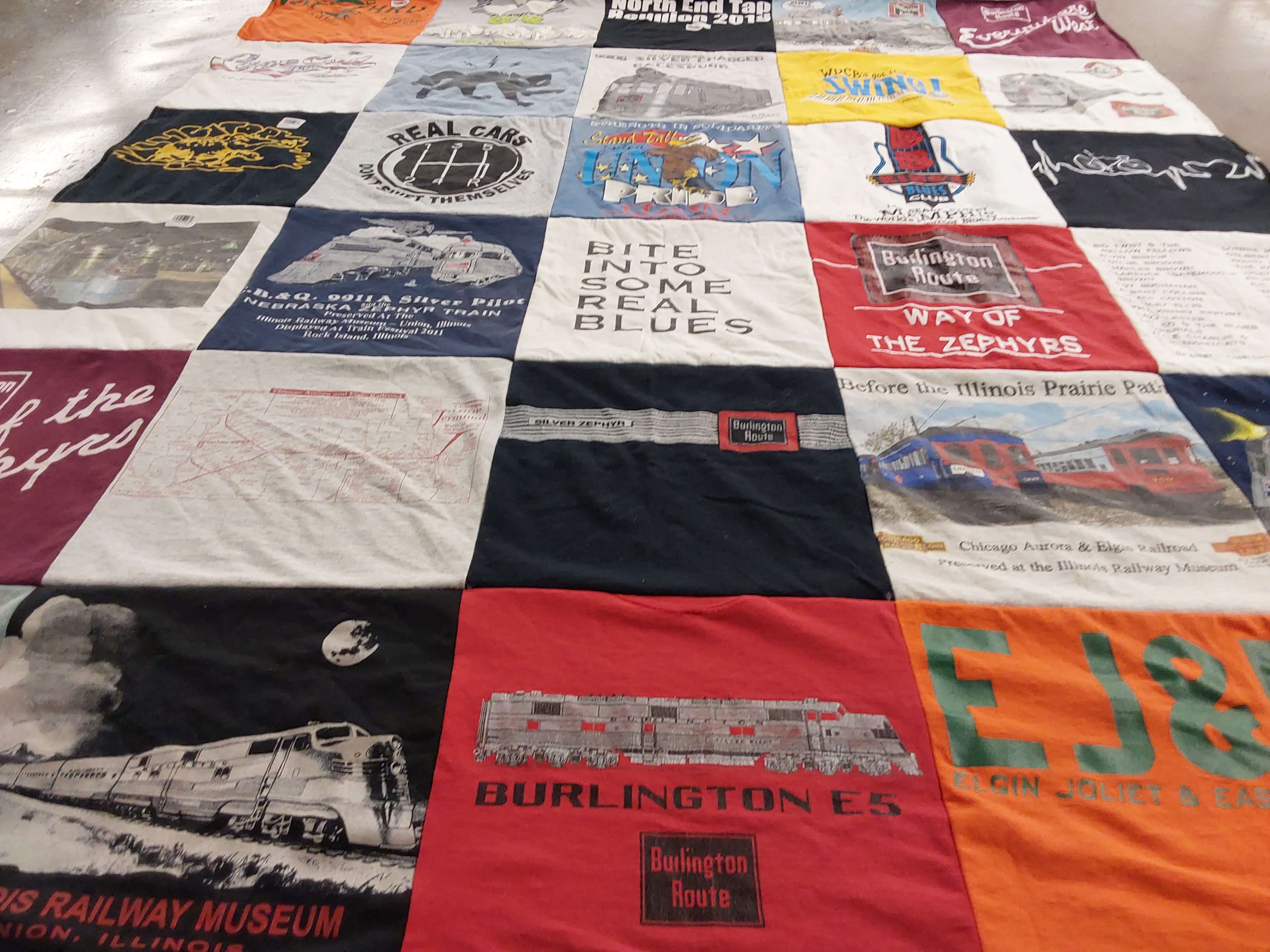 T-shirt quilt with trains, railroads themes by Laurie from IL