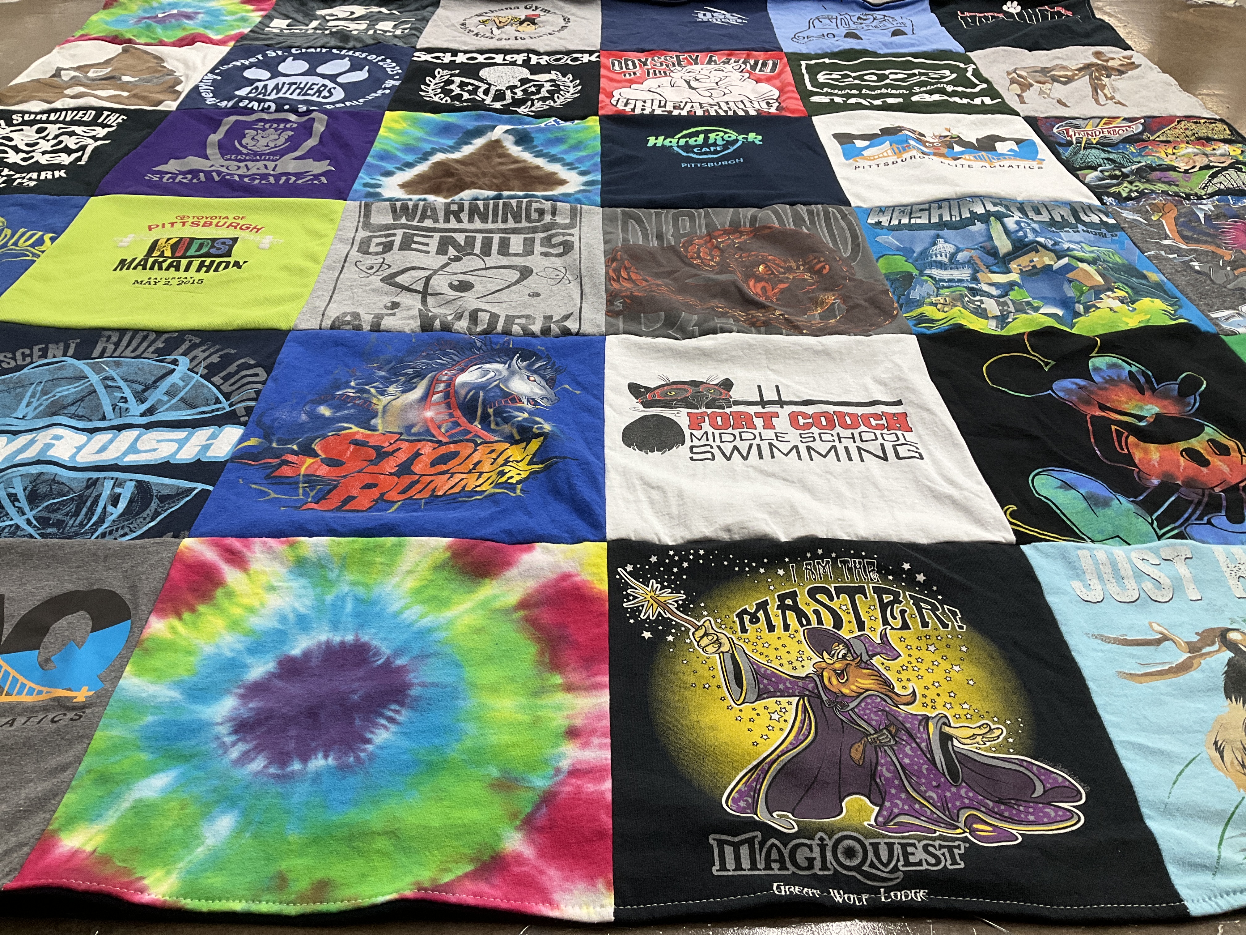 Custom Project Repat t-shirt quilt featuring shirts from fort couch middle school.