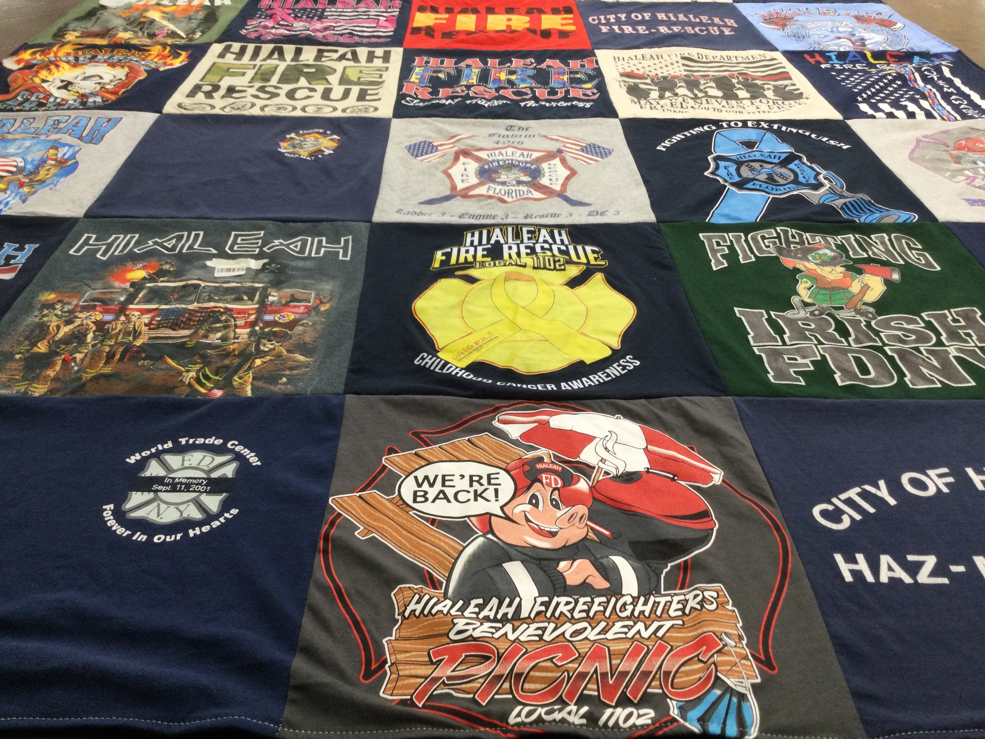 T-shirt quilt with firefighting, emergency services themes by Kevin from FL
