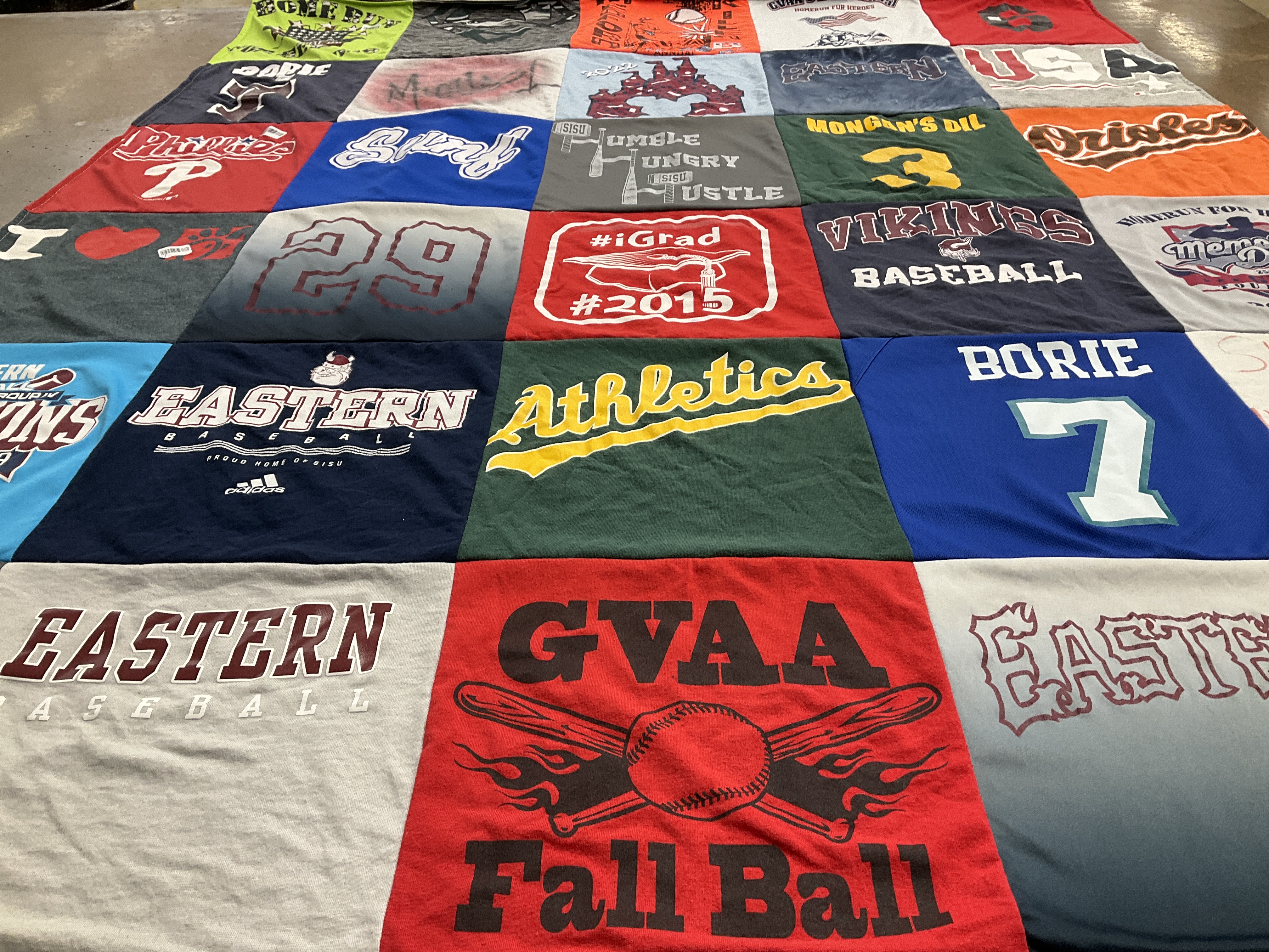Custom Project Repat t-shirt quilt featuring shirts from eastern university.