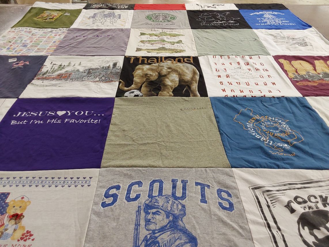 T-shirt quilt with travel, sports themes by Marcella from MD