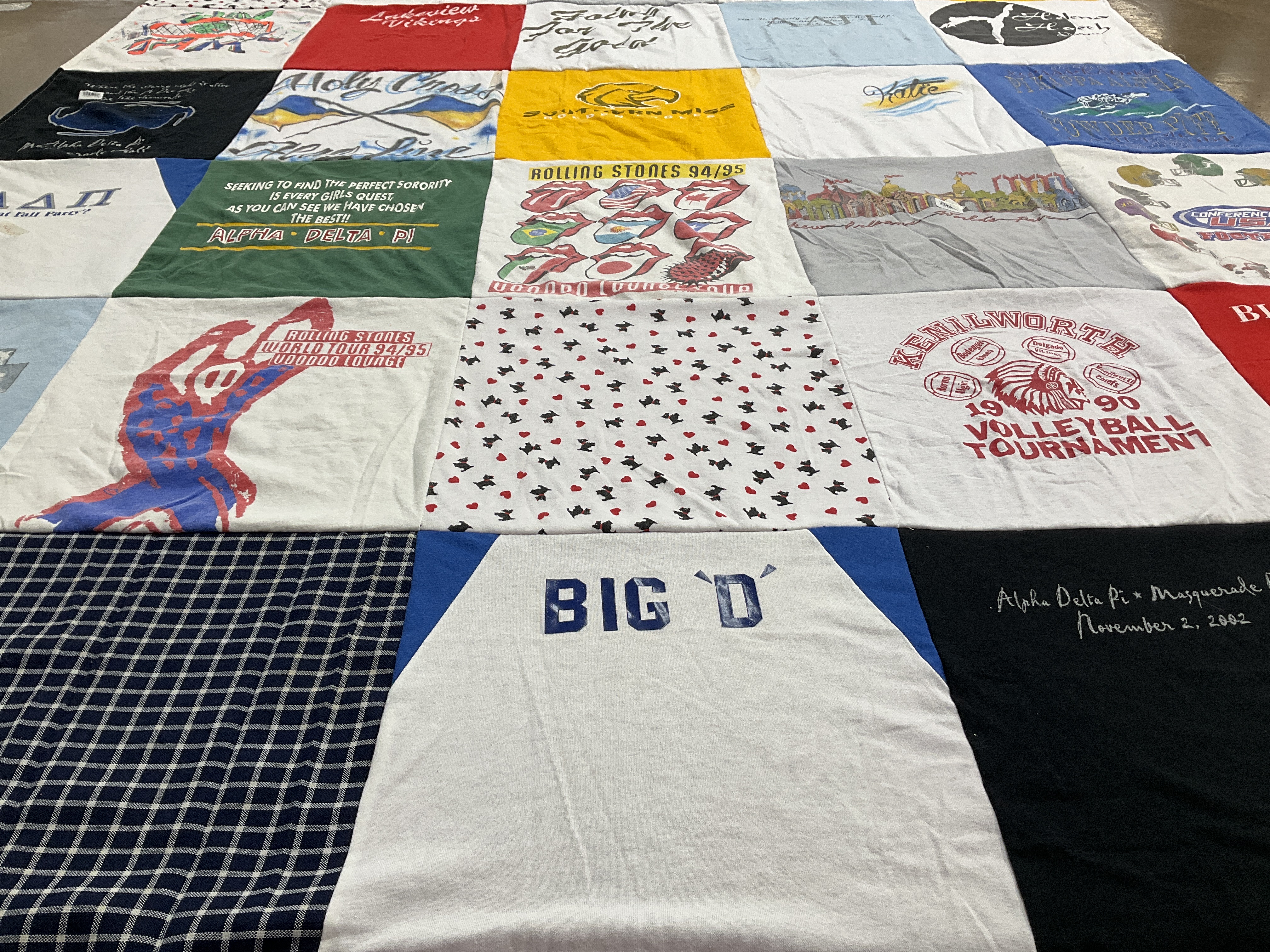 Custom Project Repat t-shirt quilt highlighting sororities, music themes.