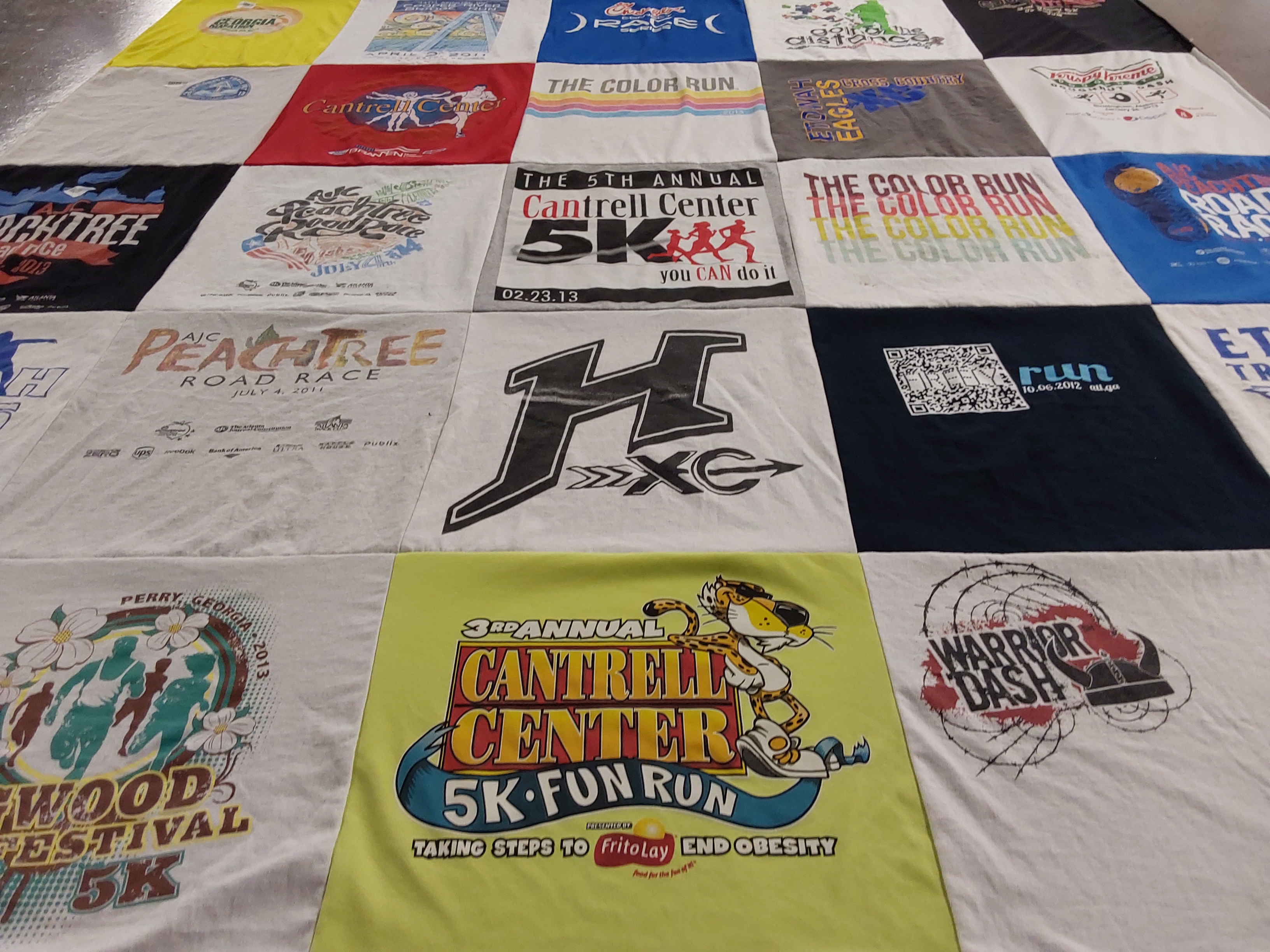 Custom Project Repat t-shirt quilt featuring shirts from h high school.