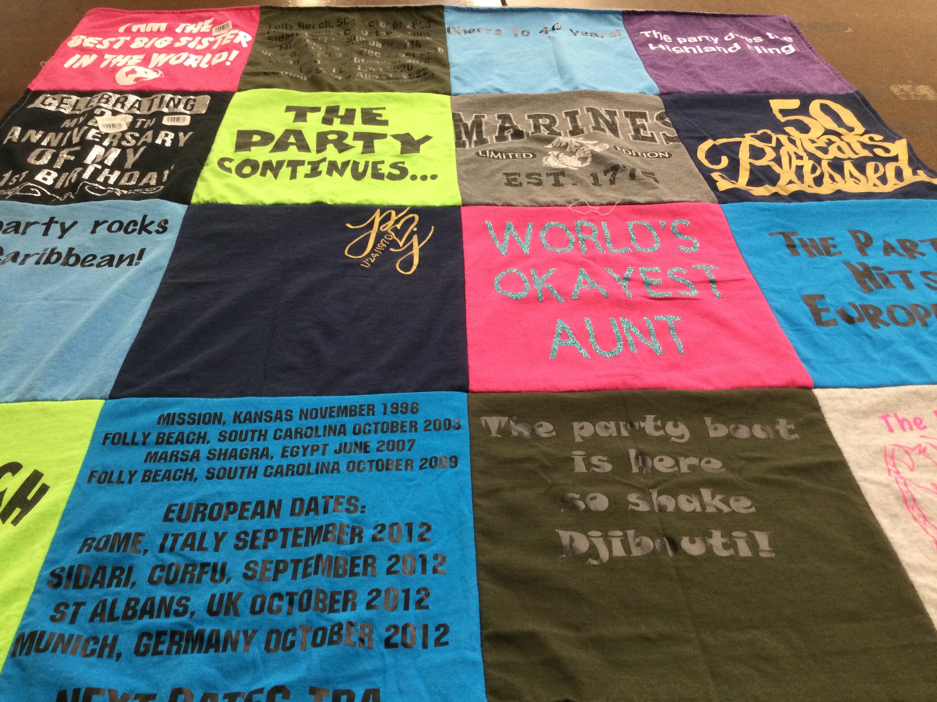 T-shirt quilt with partying, traveling themes by Christine from MN
