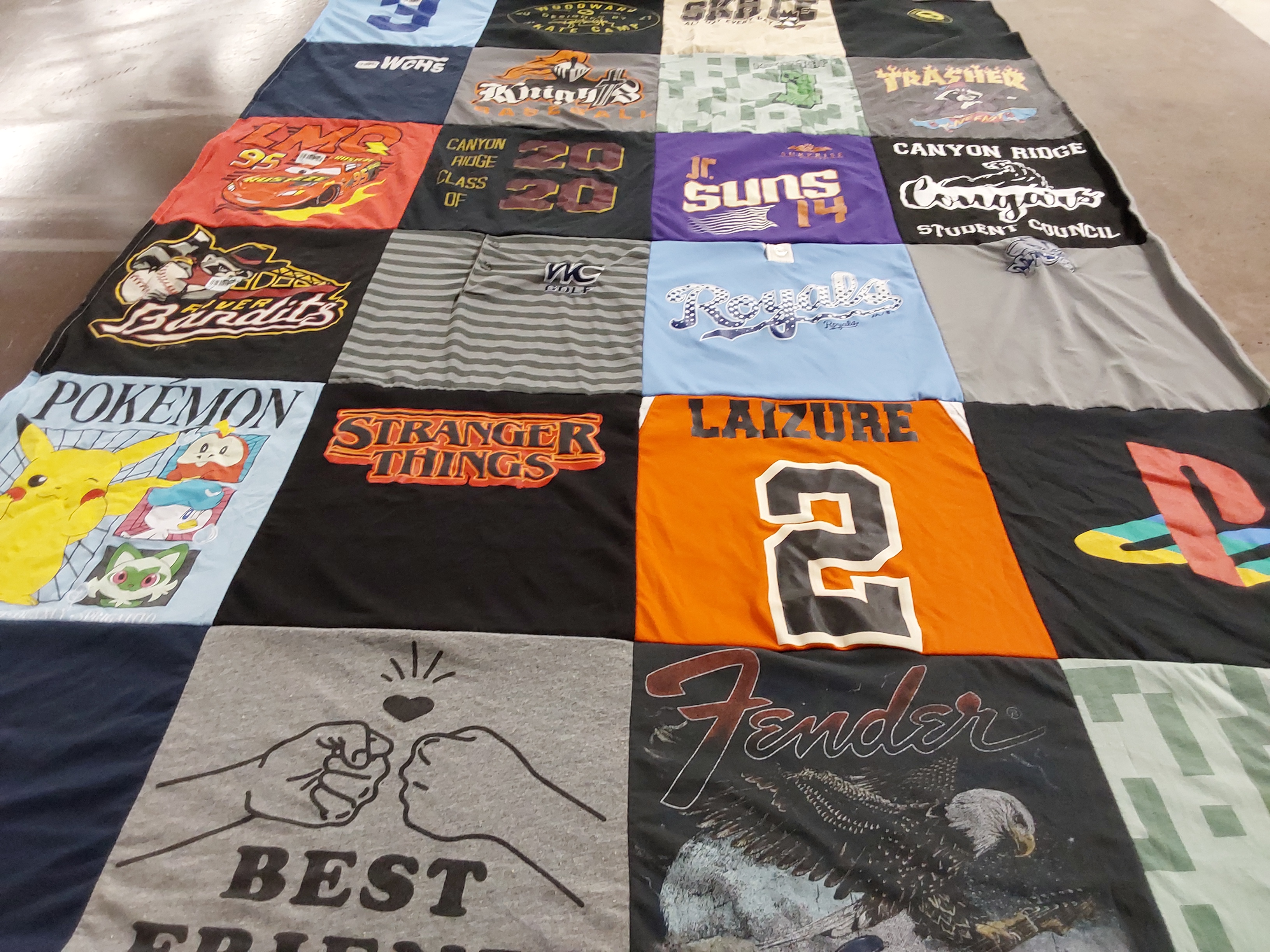 Custom Project Repat t-shirt quilt featuring shirts from canyon ridge high school.