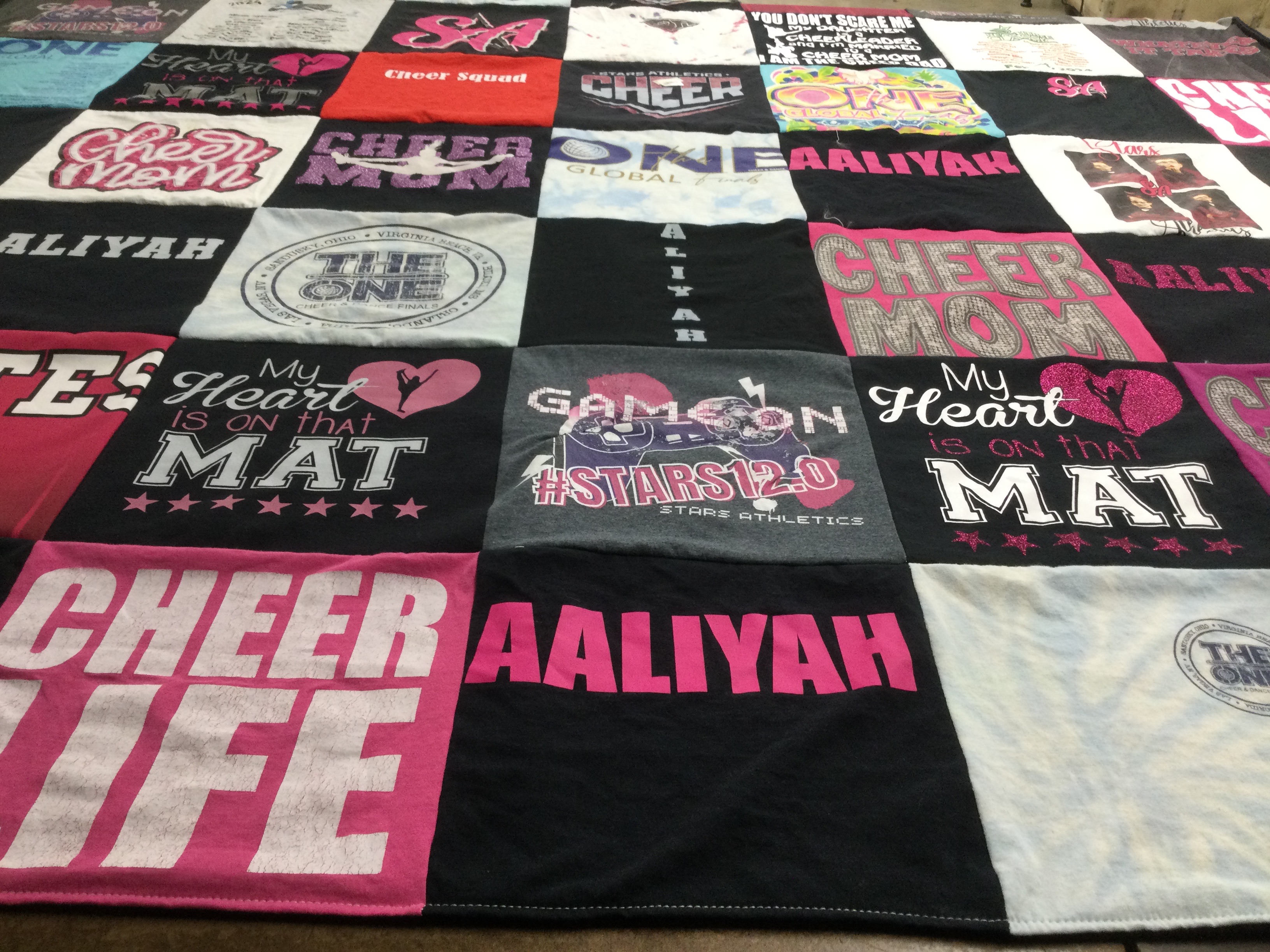 T-shirt quilt with cheerleading, sports themes by Chad from TN