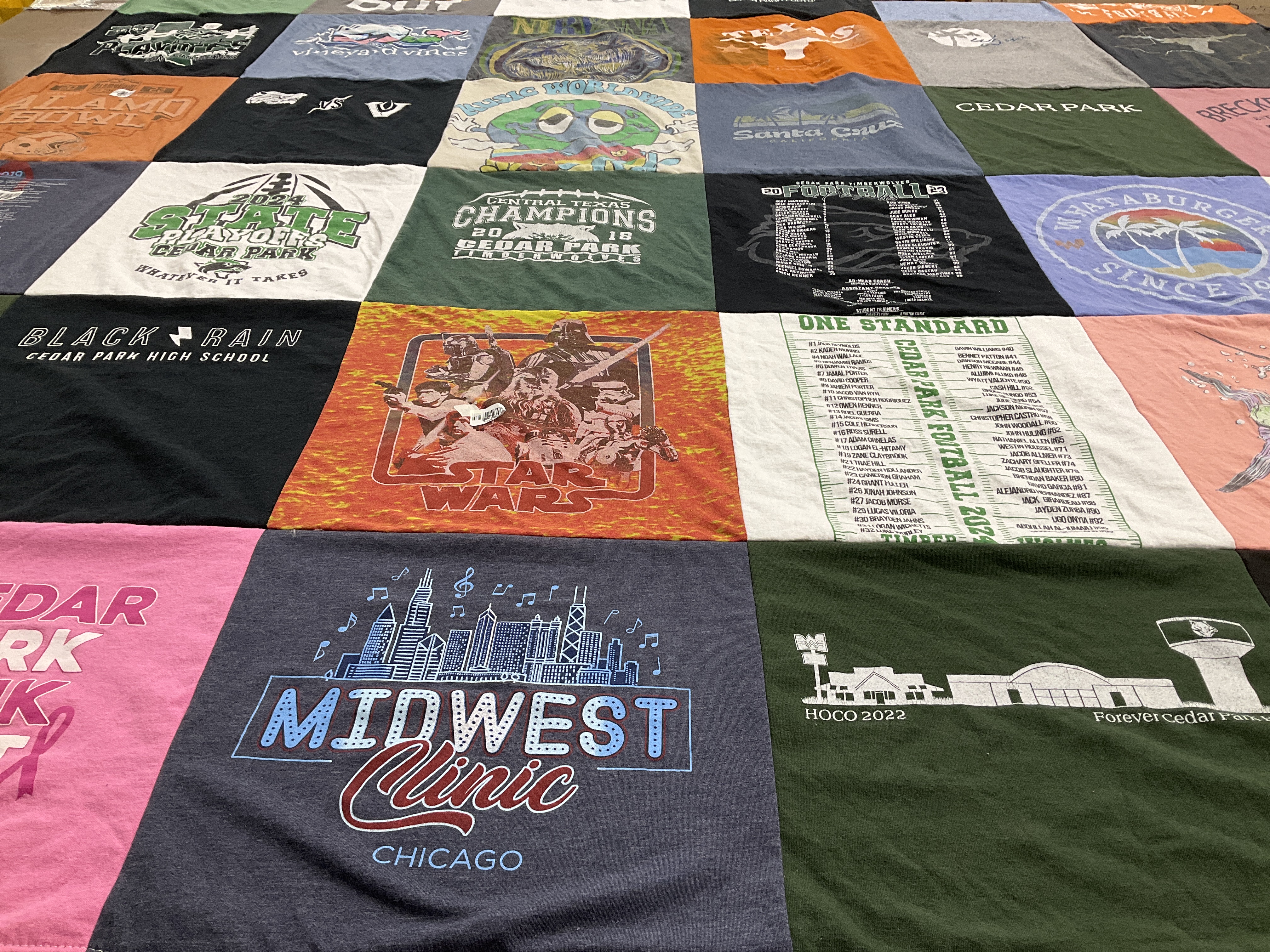 Custom Project Repat t-shirt quilt featuring shirts from cedar park high school.