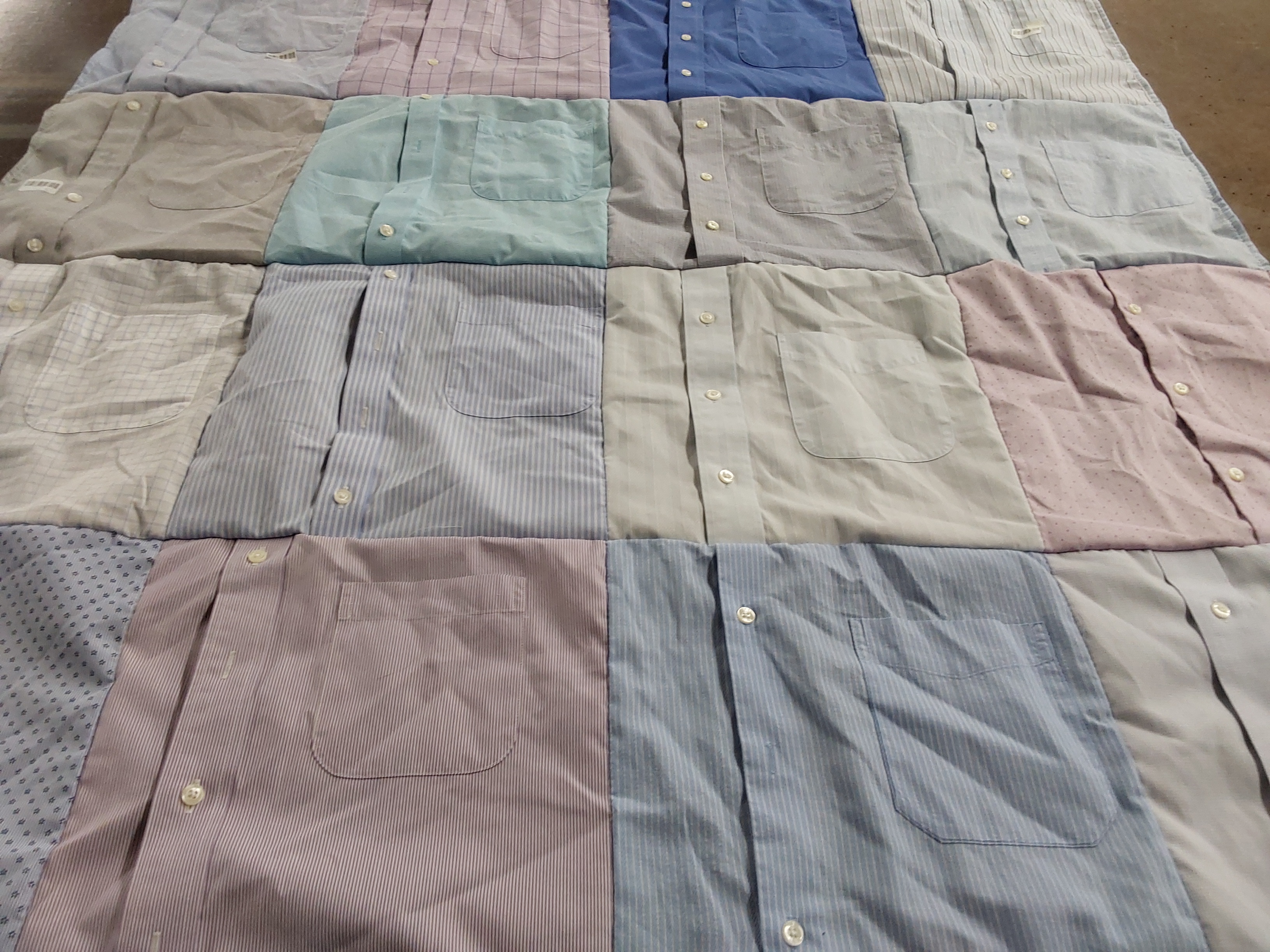 Custom Project Repat t-shirt quilt highlighting sewing, upcycling themes.