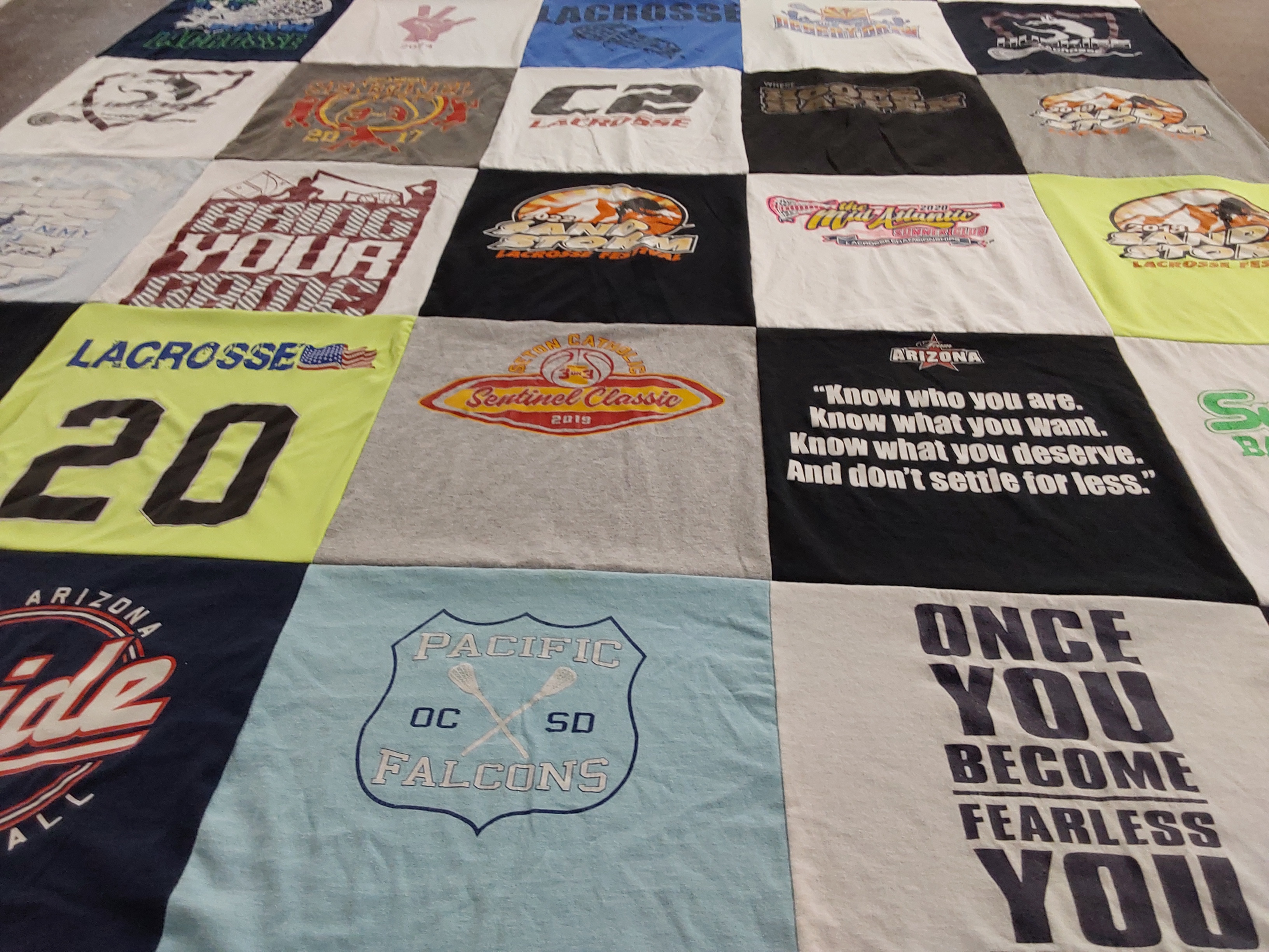 Custom Project Repat t-shirt quilt highlighting lacrosse, sports themes.