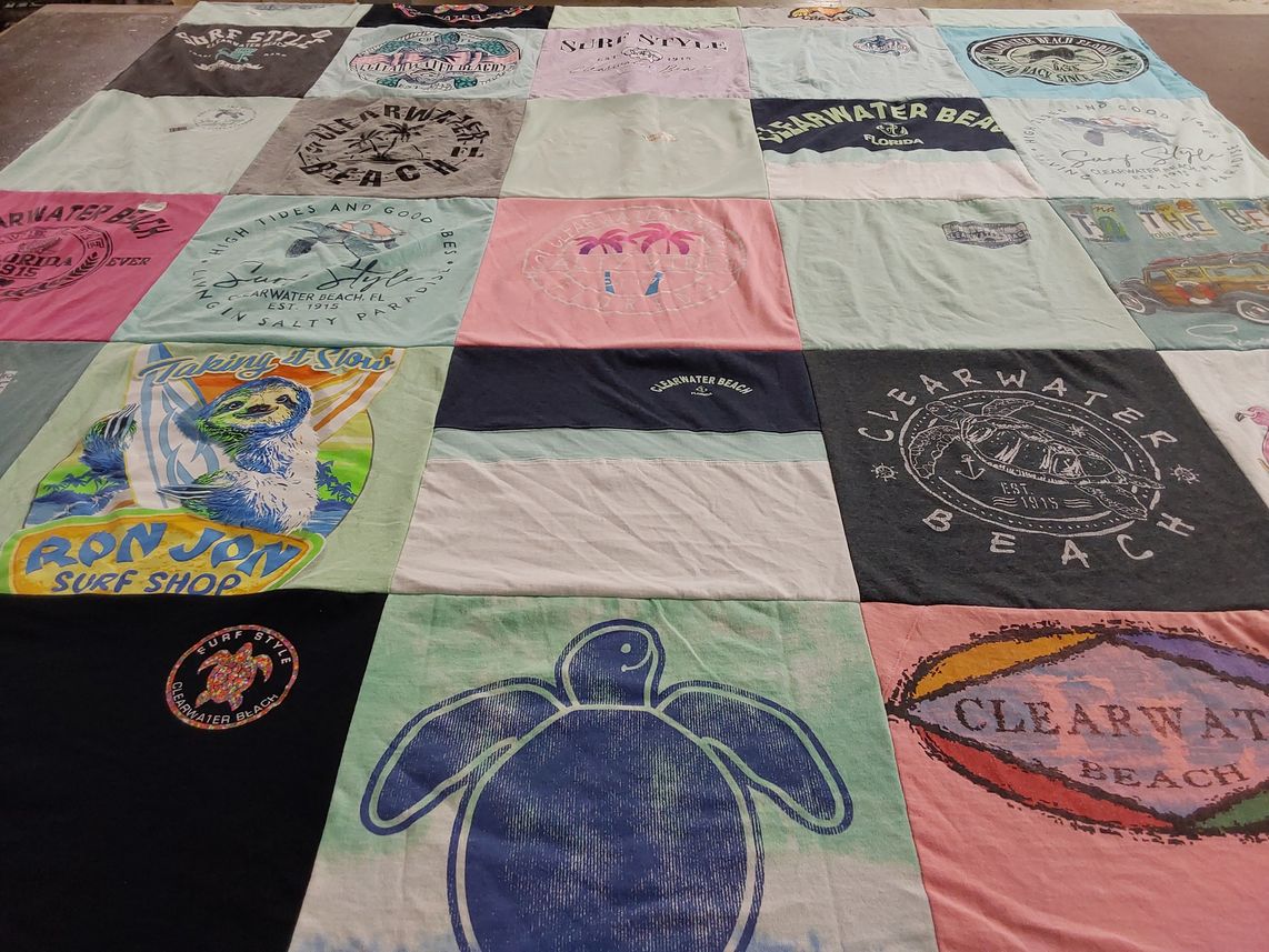 T-shirt quilt with surfing, beach activities themes by Laura from IL
