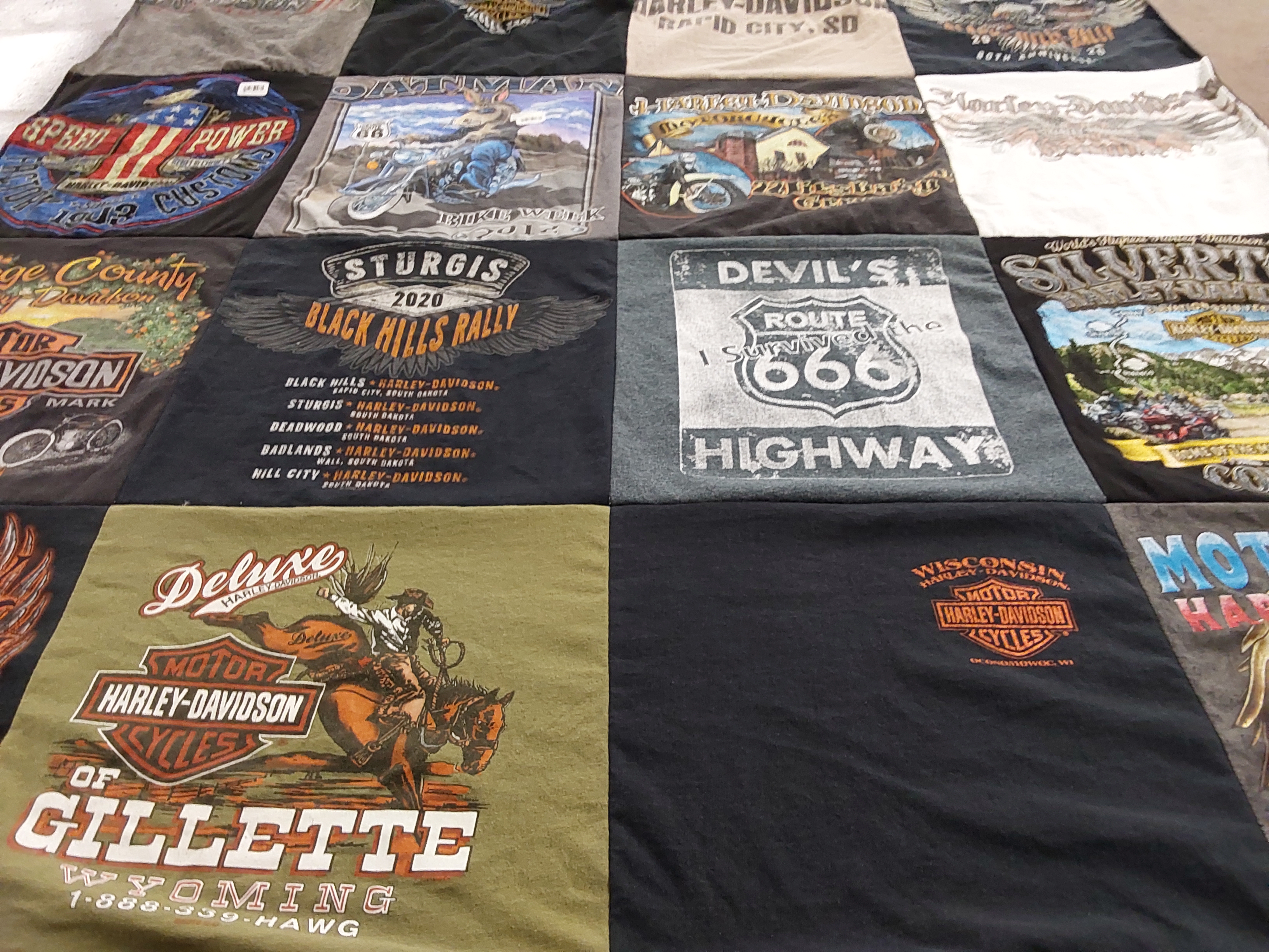 Custom Project Repat t-shirt quilt highlighting motorcycling, biking themes.