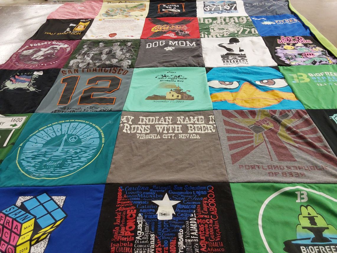 T-shirt quilt with running, travel themes by Ana from CA