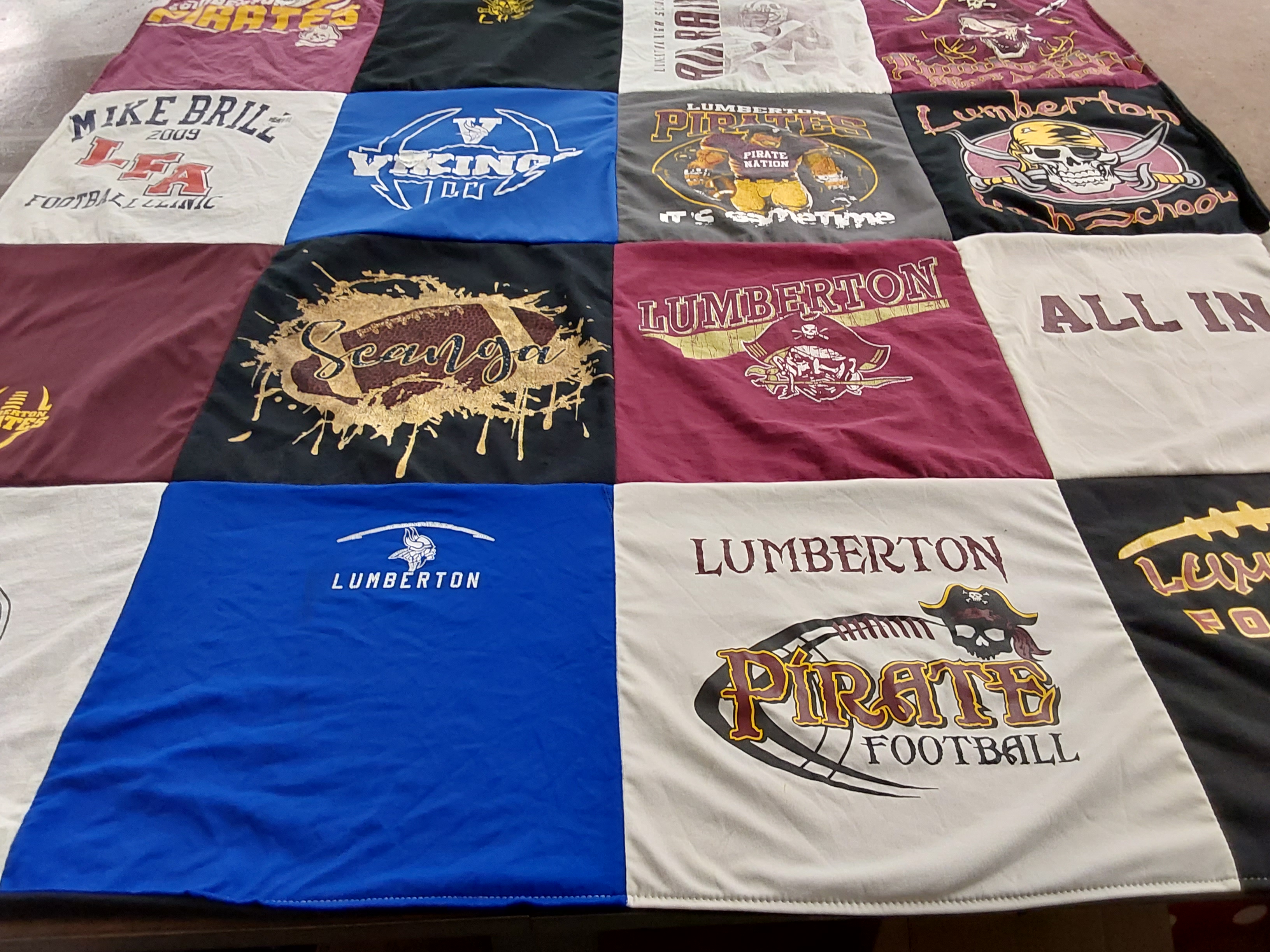Custom Project Repat t-shirt quilt featuring shirts from lumberton high school.