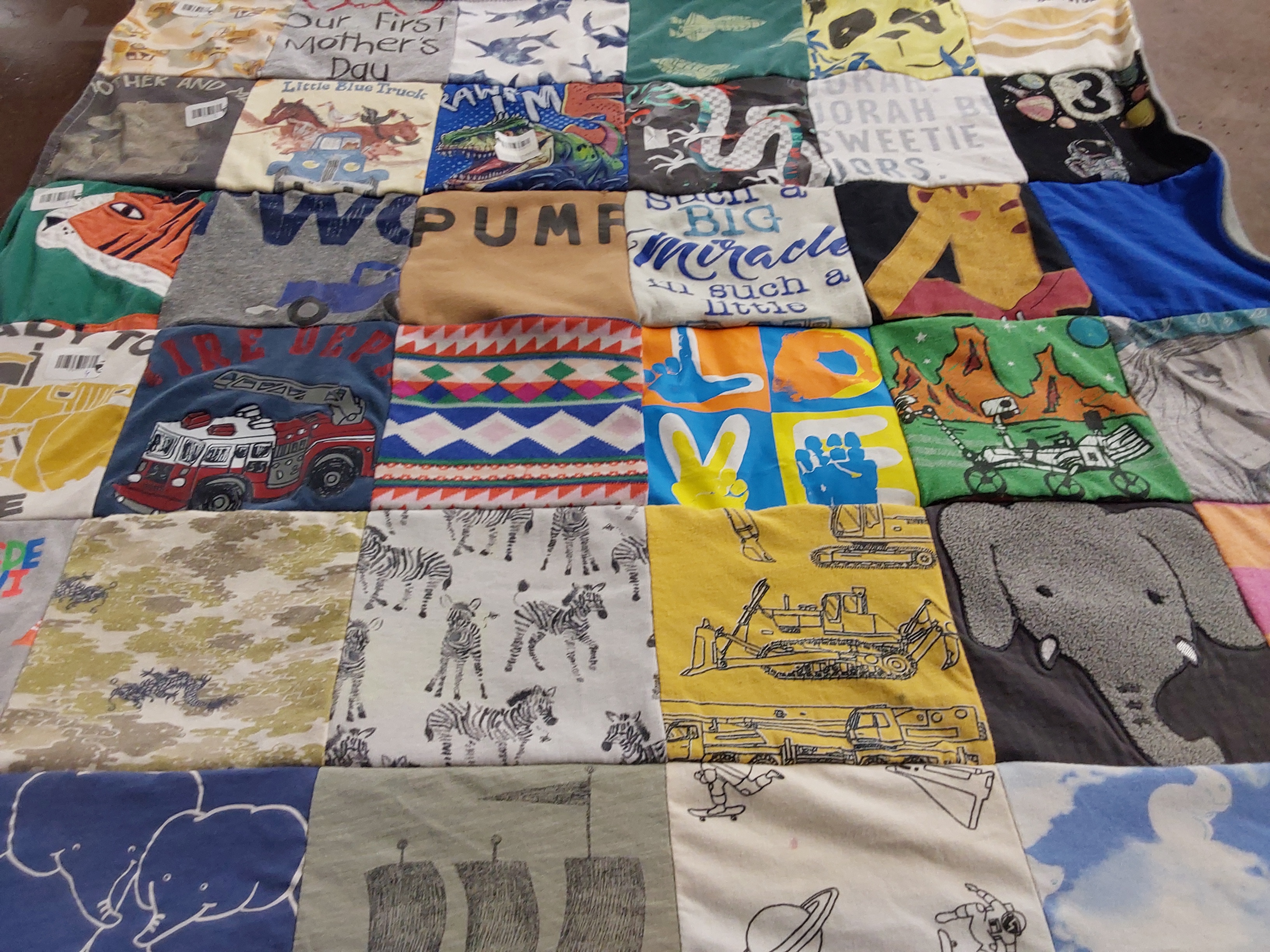 T-shirt quilt with animals, fire trucks themes by Rebekah from NC