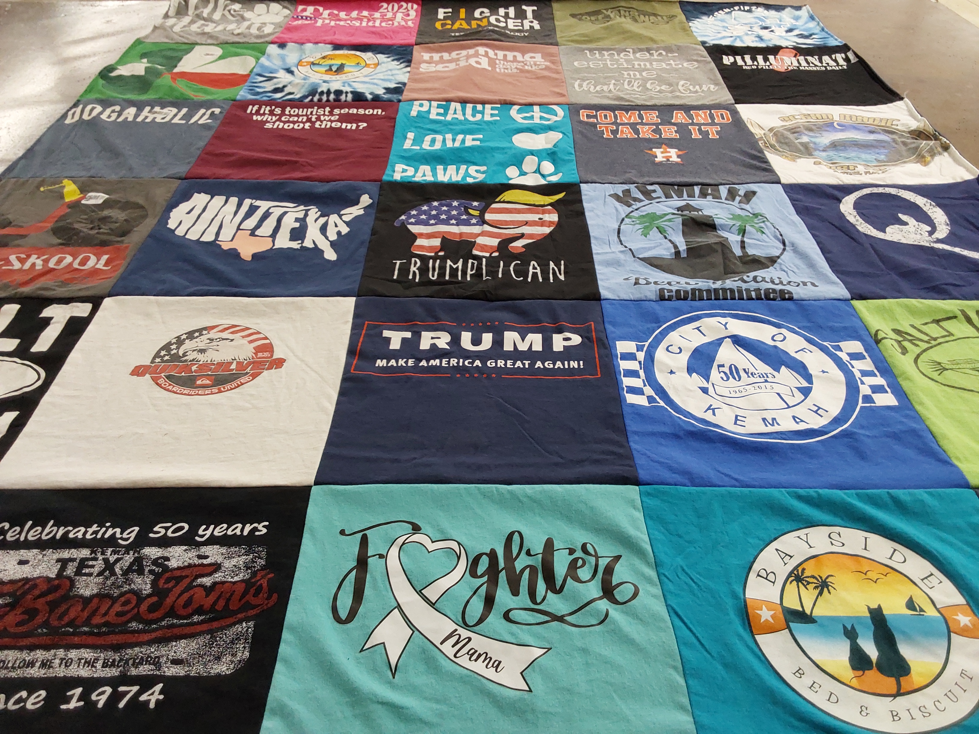 Custom Project Repat t-shirt quilt highlighting politics, pet care themes.