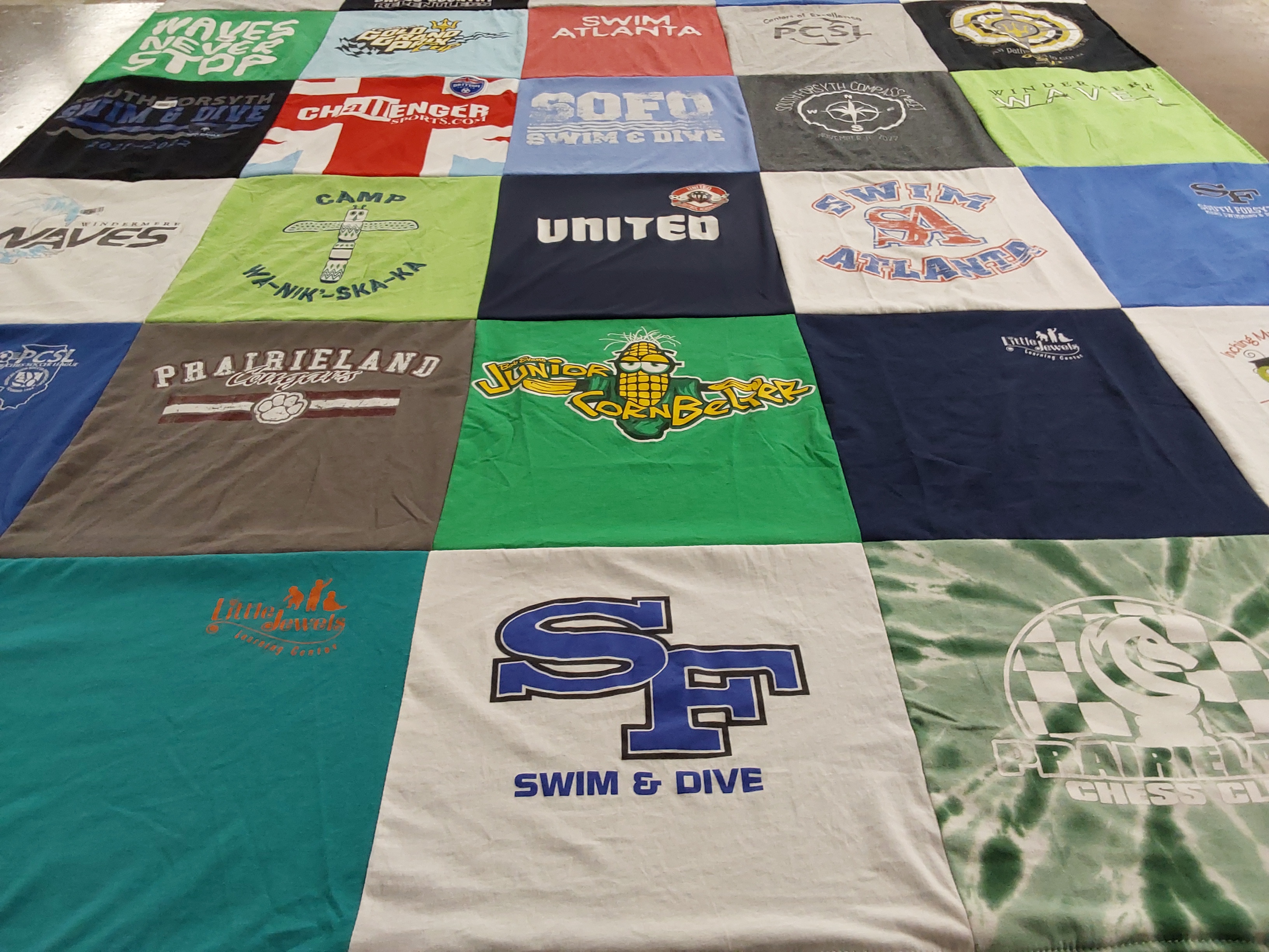 Custom Project Repat t-shirt quilt featuring shirts from prairieland high school.