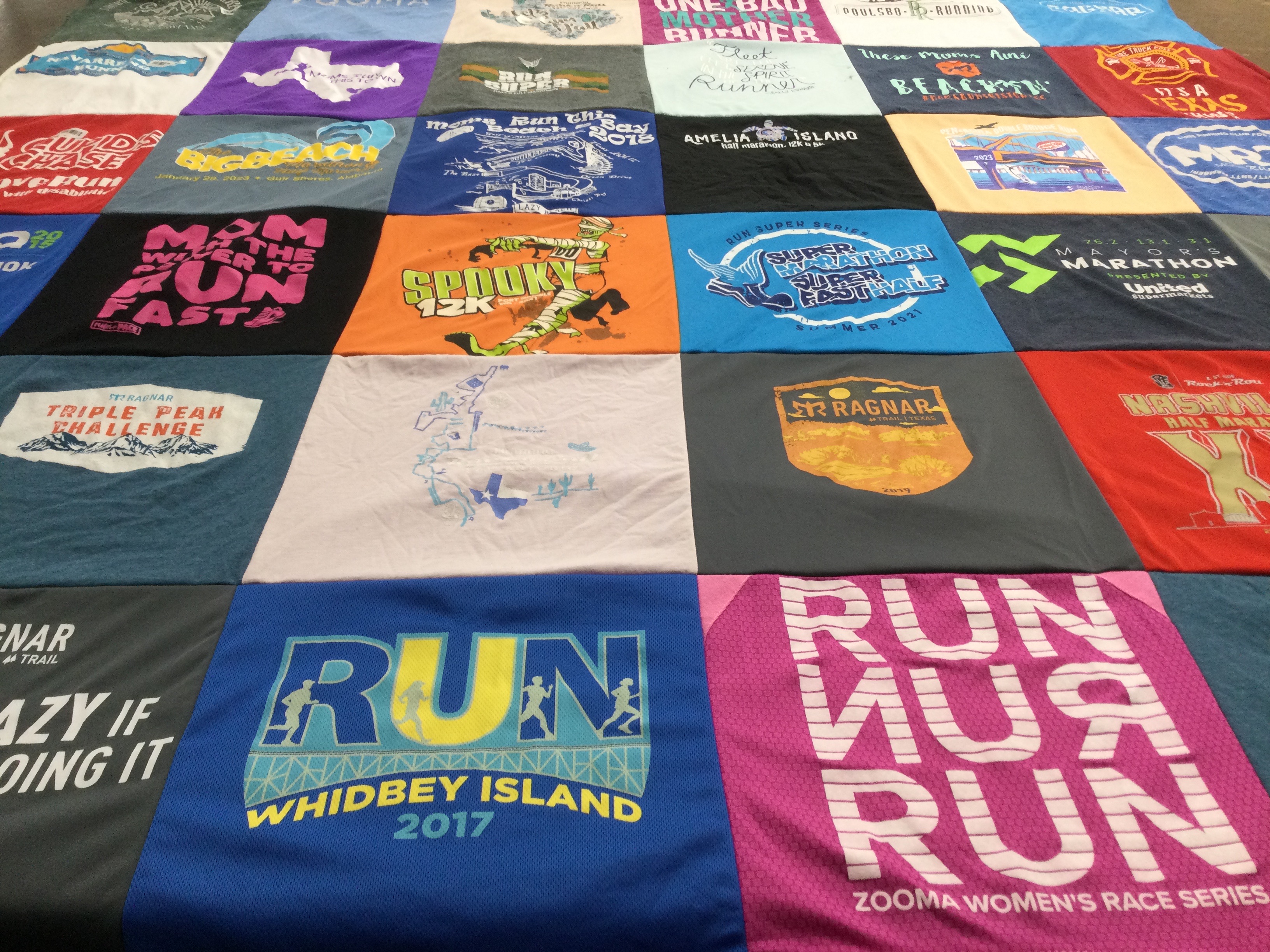 T-shirt quilt with running, sports themes by Mary from FL