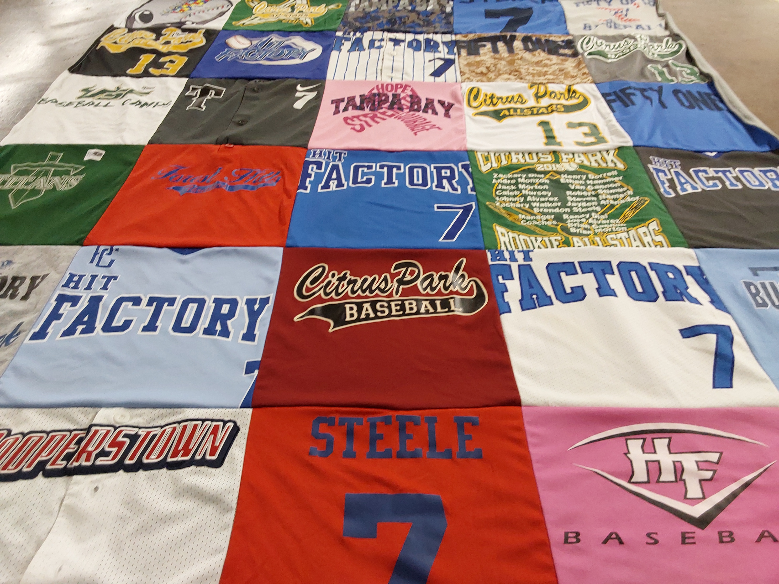 Custom Project Repat t-shirt quilt featuring shirts from tampa bay community college.