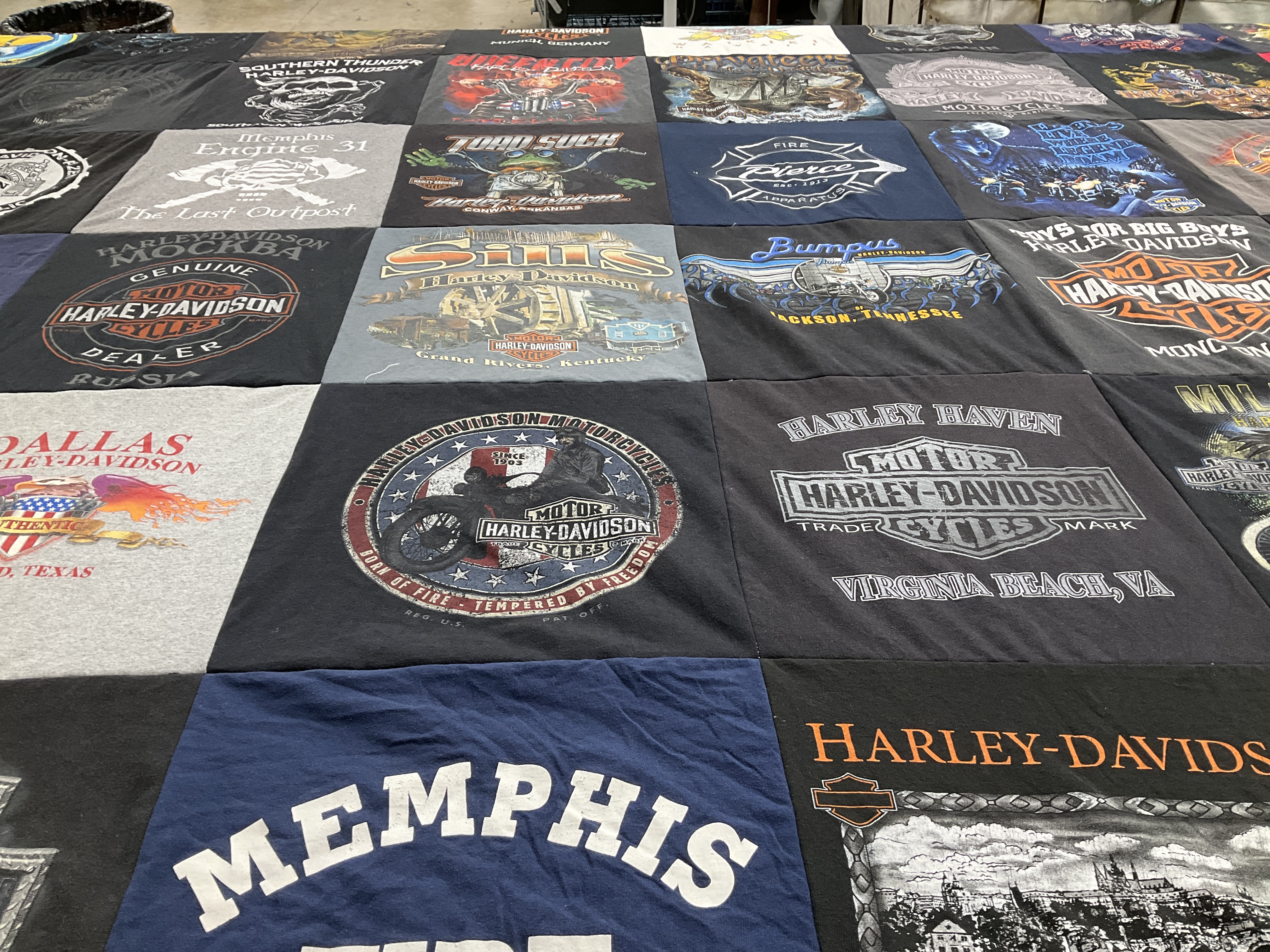 Custom Project Repat t-shirt quilt highlighting motorcycles, biking themes.