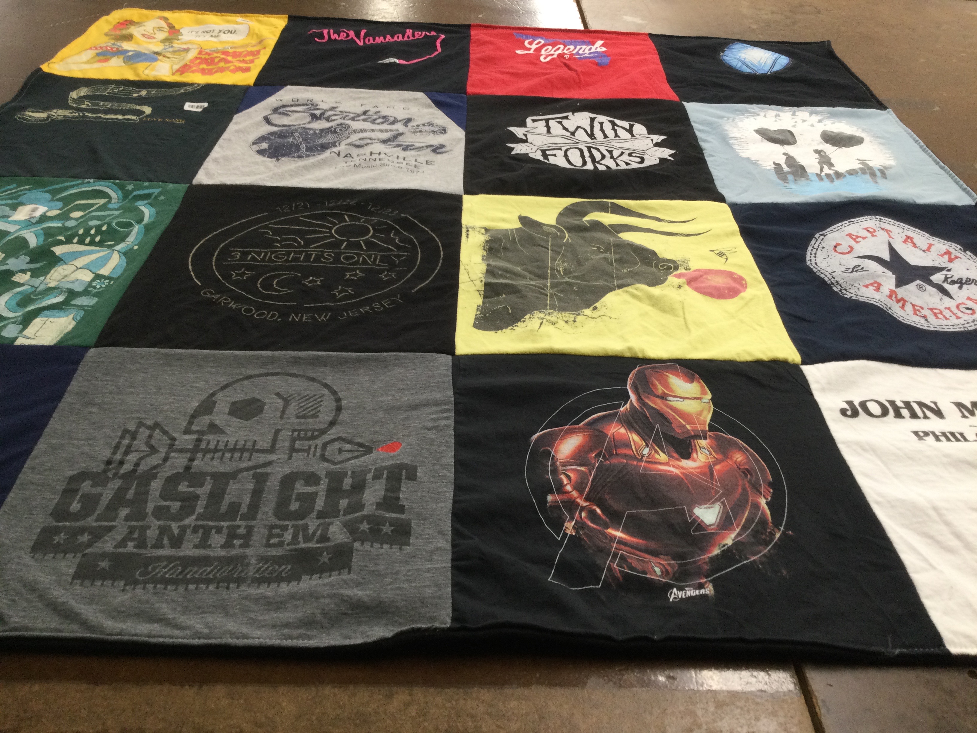 T-shirt quilt with music, travel themes by Eileen from NJ